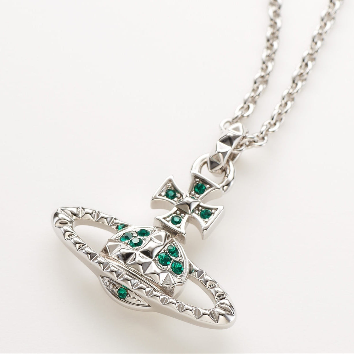 Vivienne Westwood Emerald Crystal Orb Necklace, featuring a silver-tone pendant adorned with emerald green crystals