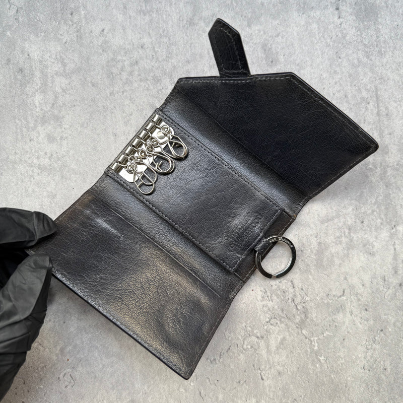 Vivienne Westwood Grey Leather Key Holder with Orb logo, loop-through tab closure, and interior key hooks
