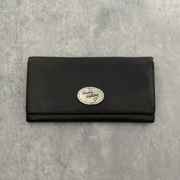 Vivienne Westwood Icon Signature Long Wallet in black leather, featuring logo plaque, multiple card slots and zip compartment interior, snap button closure, vintage condition.