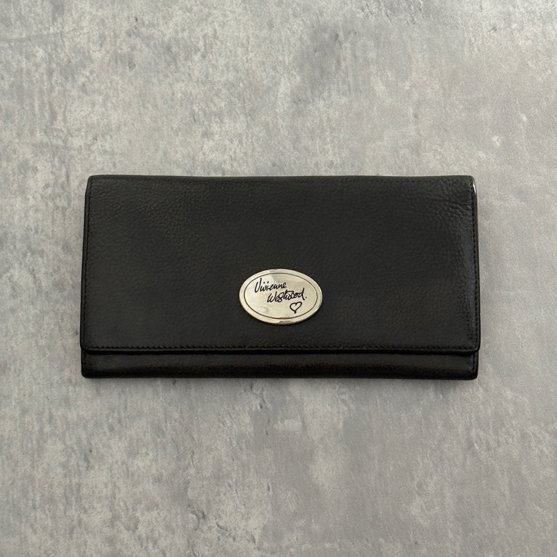 Vivienne Westwood Icon Signature Long Wallet in black leather, featuring logo plaque, multiple card slots and zip compartment interior, snap button closure, vintage condition.