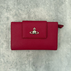 Vivienne Westwood Logo Orb Clip Wallet in Rose Pink Saffiano Leather with silver-tone emblem, card slots, and zippered coin pouch.