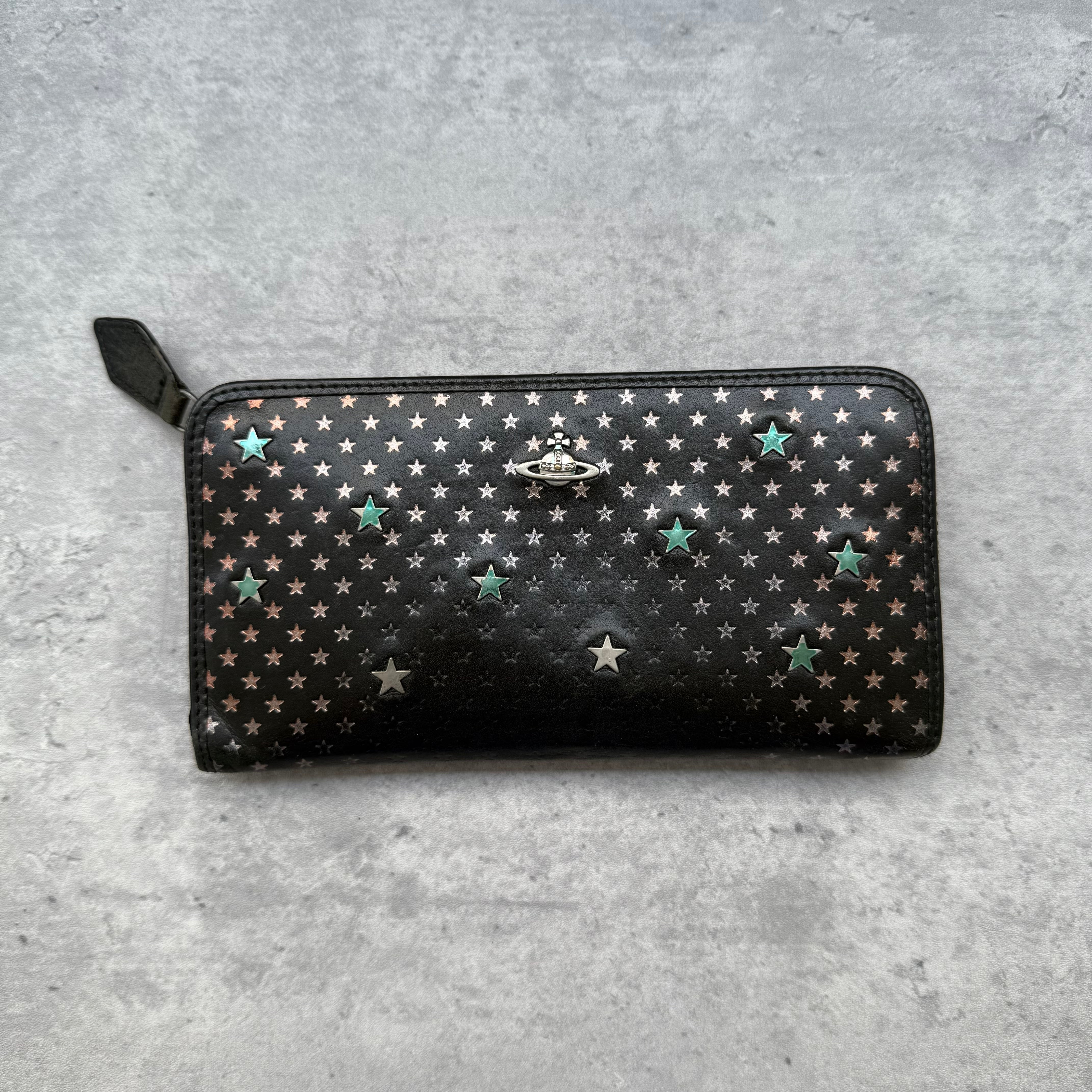 Vivienne Westwood Orb All-Over Star Long Wallet in black leather, featuring metallic star print design, signature Orb emblem, and zip-around closure with multiple compartments.