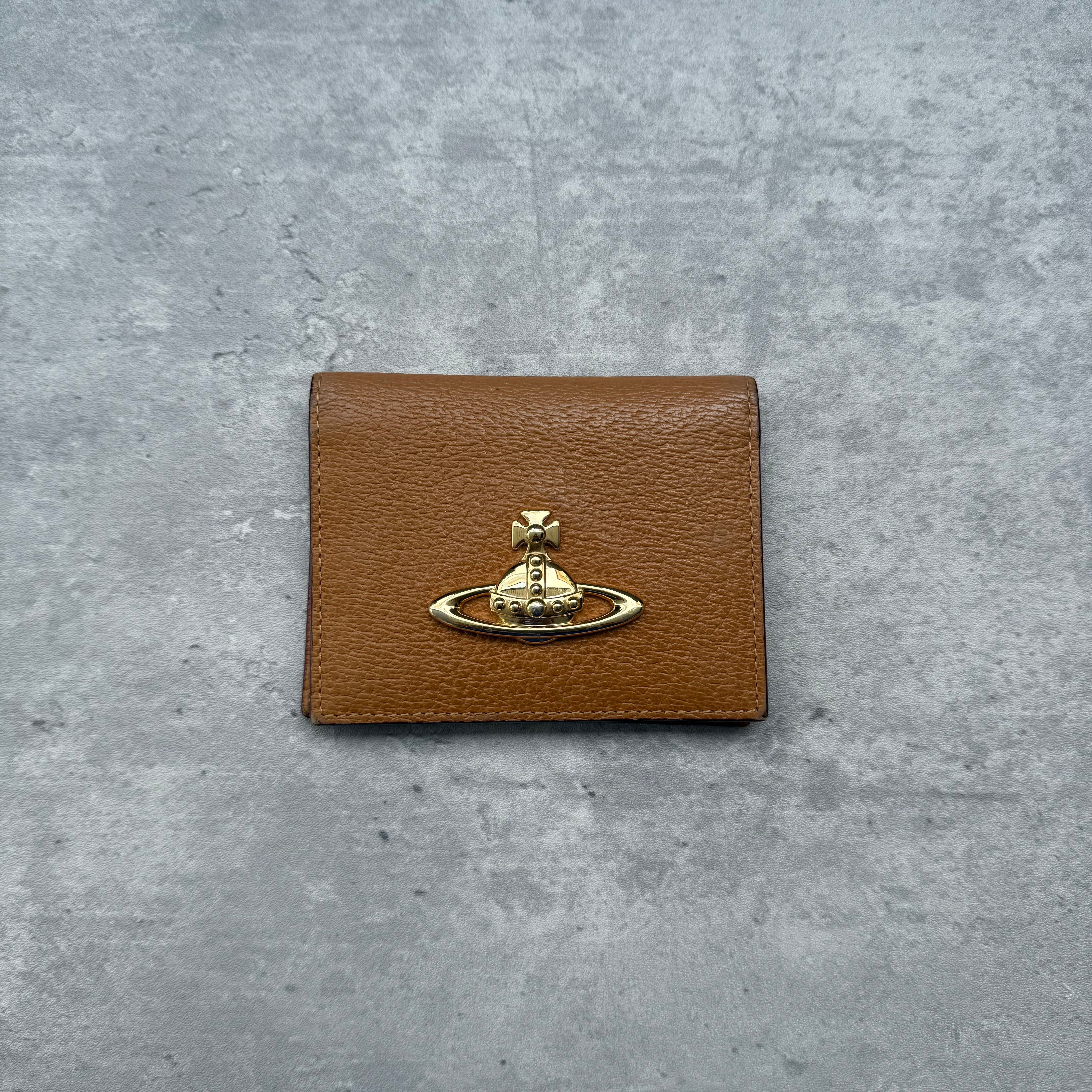 Vivienne Westwood Orb Bifold Mini Wallet in textured beige leather with gold-tone Orb emblem and dual ID slots.