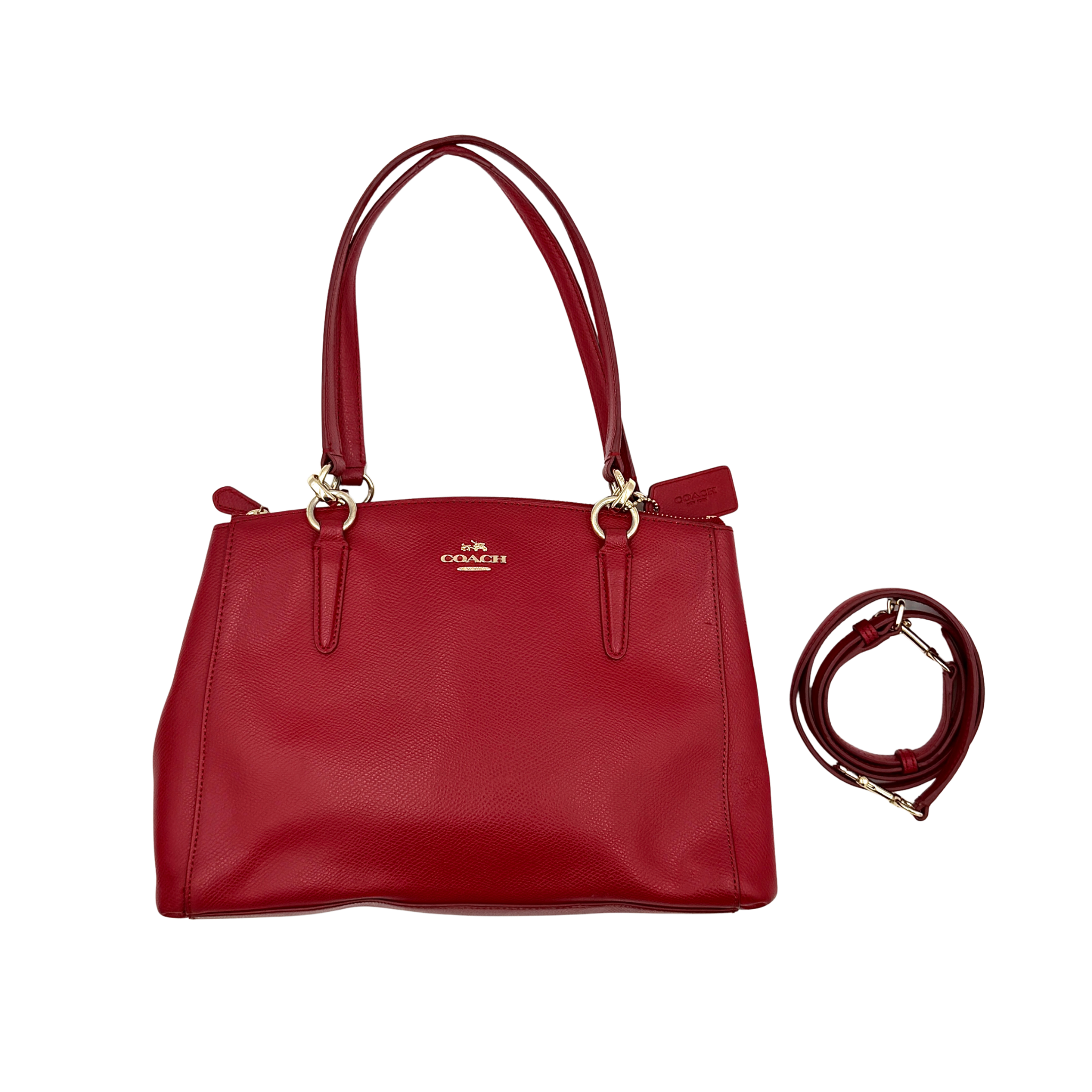 Coach 2Way Christie Carryall handbag in red pebbled leather featuring gold-tone hardware, double top handles, top zip closure, and detachable long strap for crossbody wear.