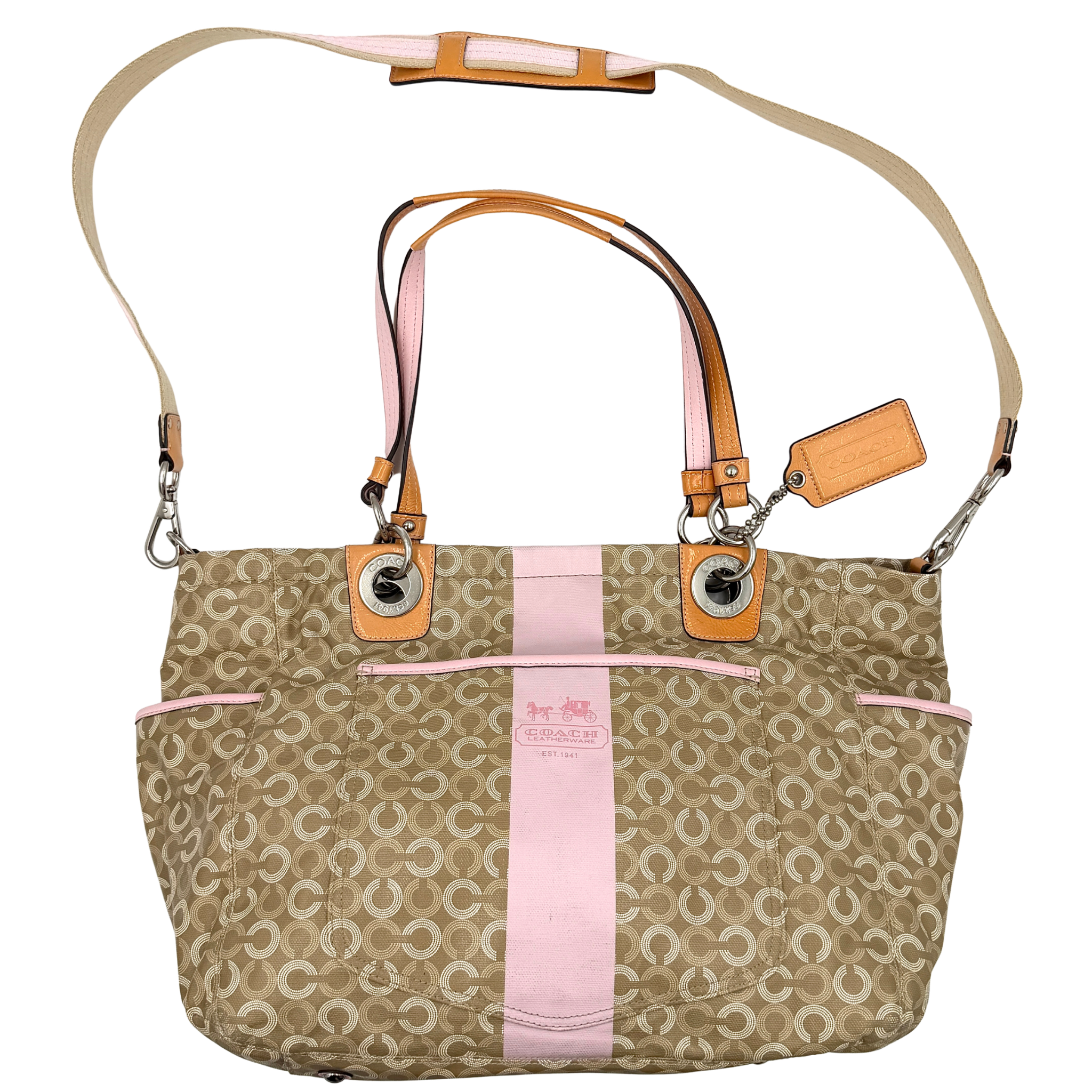 Coach 2Way signature tote bag in beige canvas featuring a pink centre stripe, leather trim, top zip closure, double handles, and detachable long strap for crossbody wear.