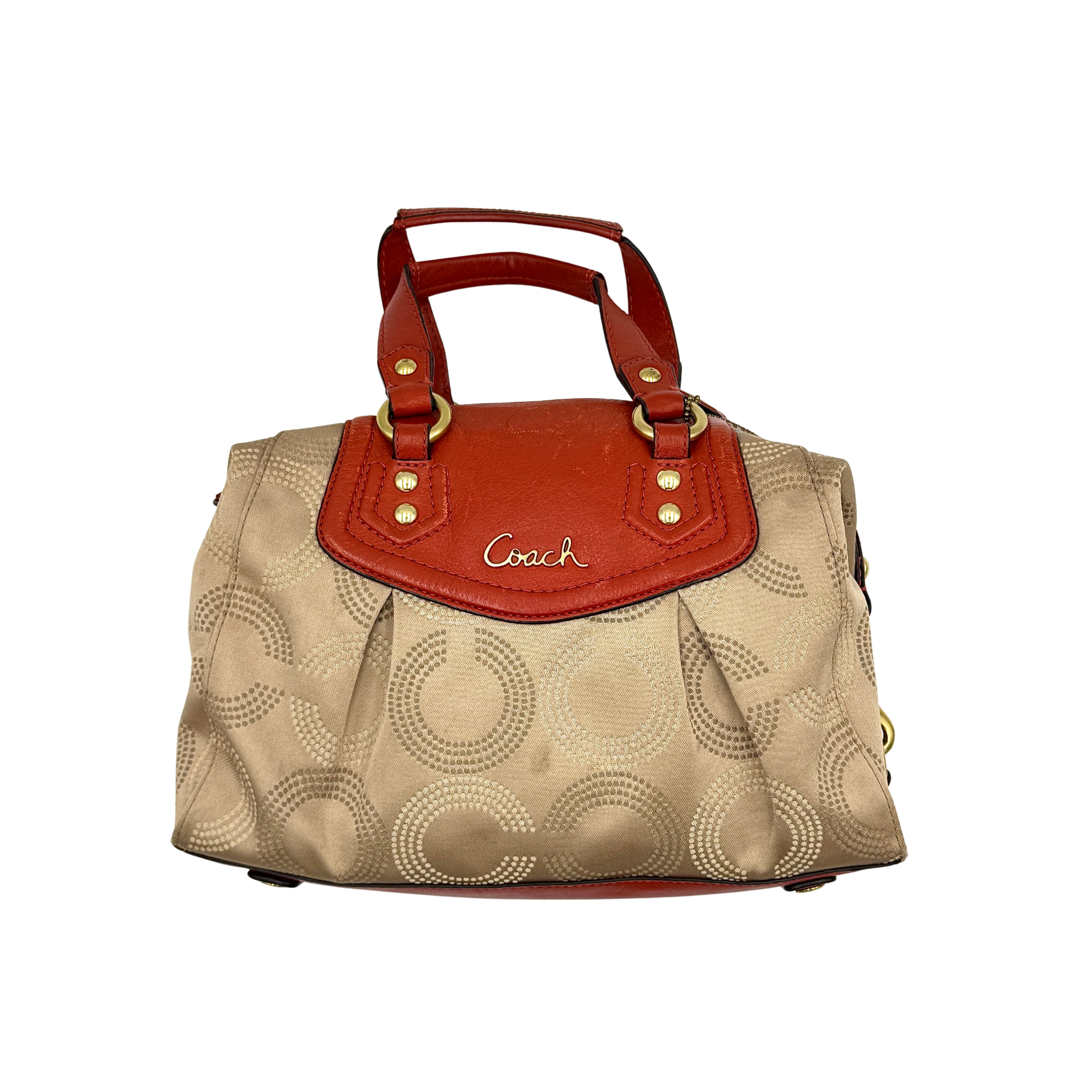 Coach Ashley handbag in orange and beige with dotted op art pattern and dual handles.