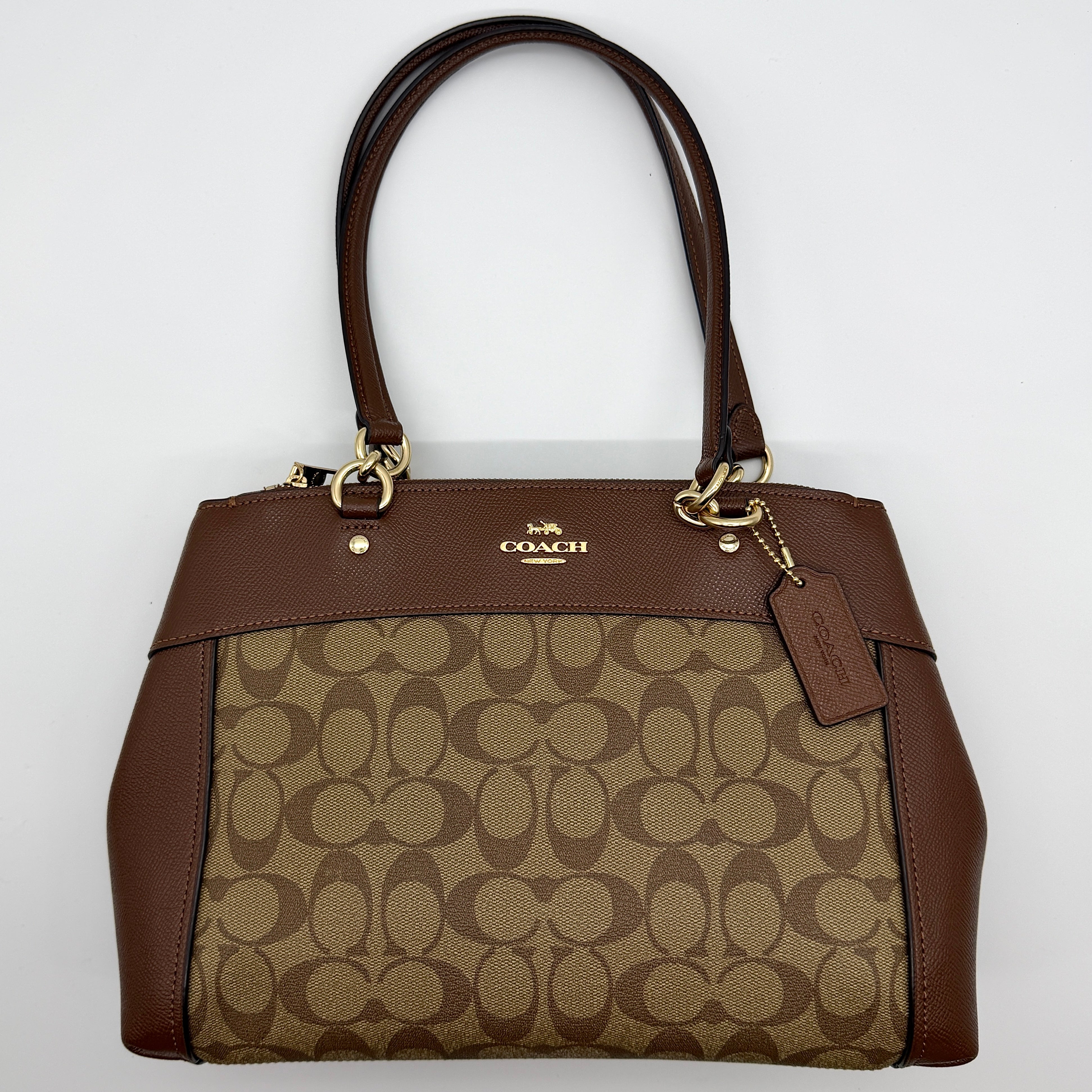 Coach Brooke Carryall Shoulder Bag in beige and brown signature canvas with gold-tone hardware and multi-compartment interior.