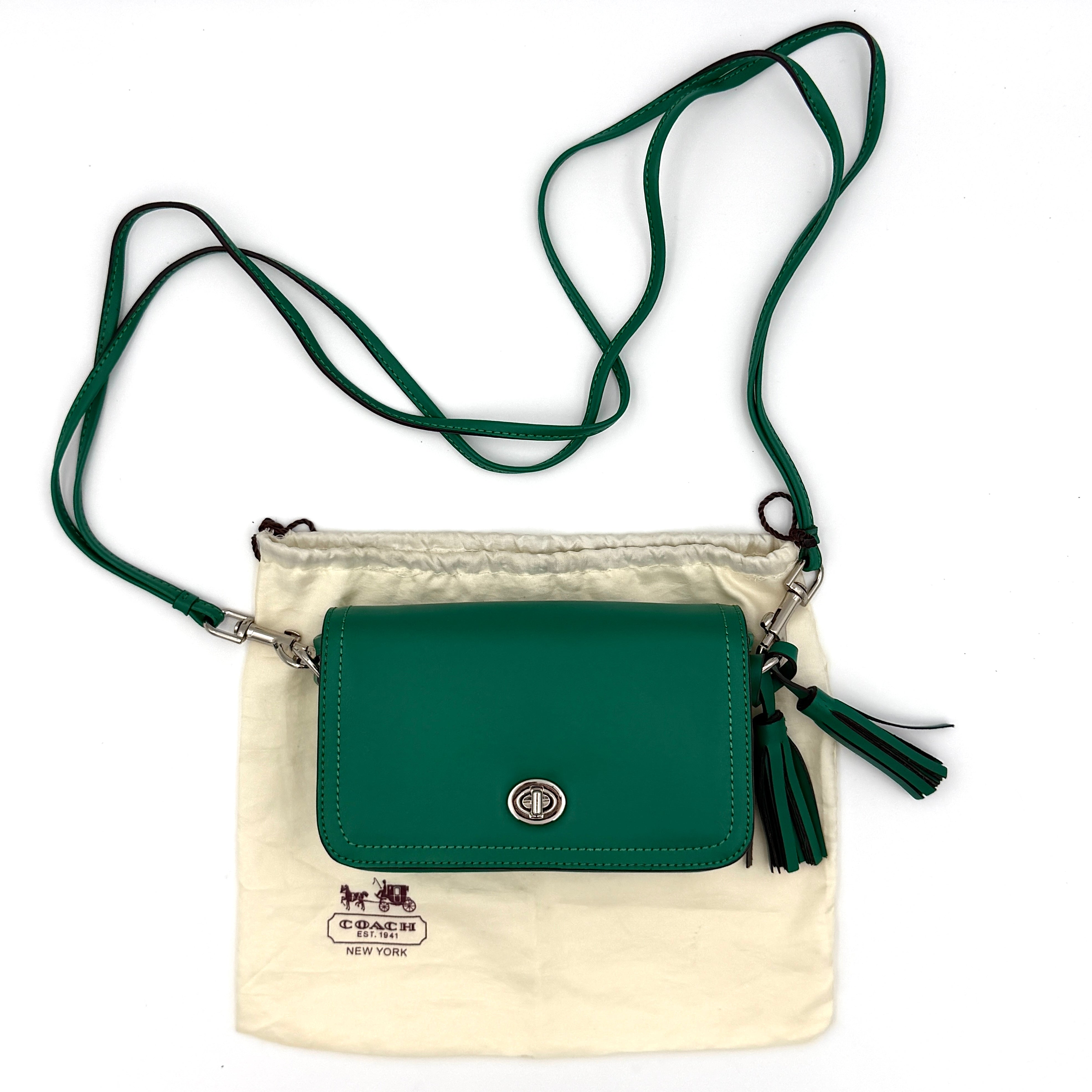 Coach Legacy Penny Crossbody Bag in emerald green leather featuring a front flap with silver-tone turnlock closure and adjustable crossbody strap.