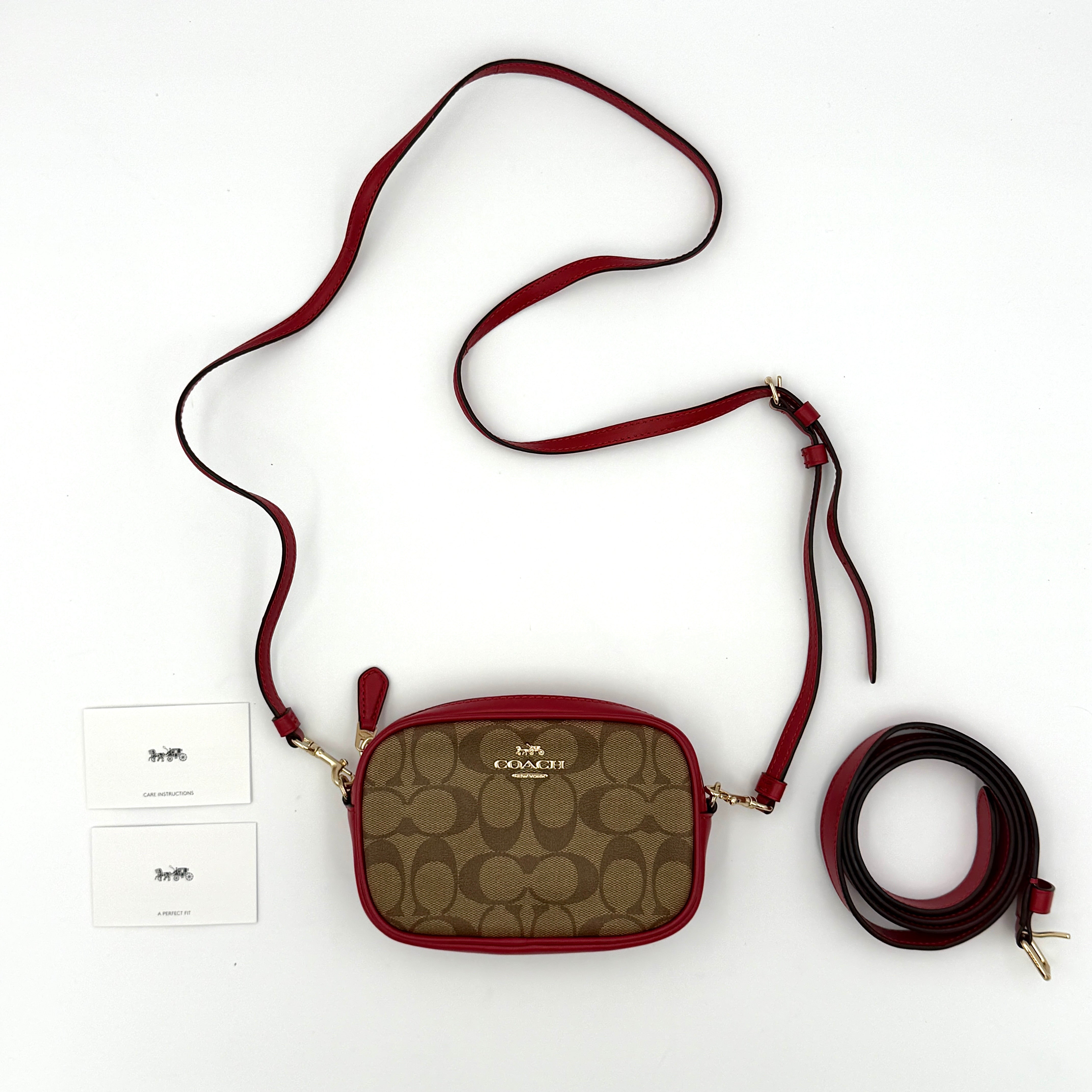 Coach Mini Jamie Crossbody Bag in beige signature monogram canvas with red leather trim, gold-tone hardware, and adjustable crossbody strap.