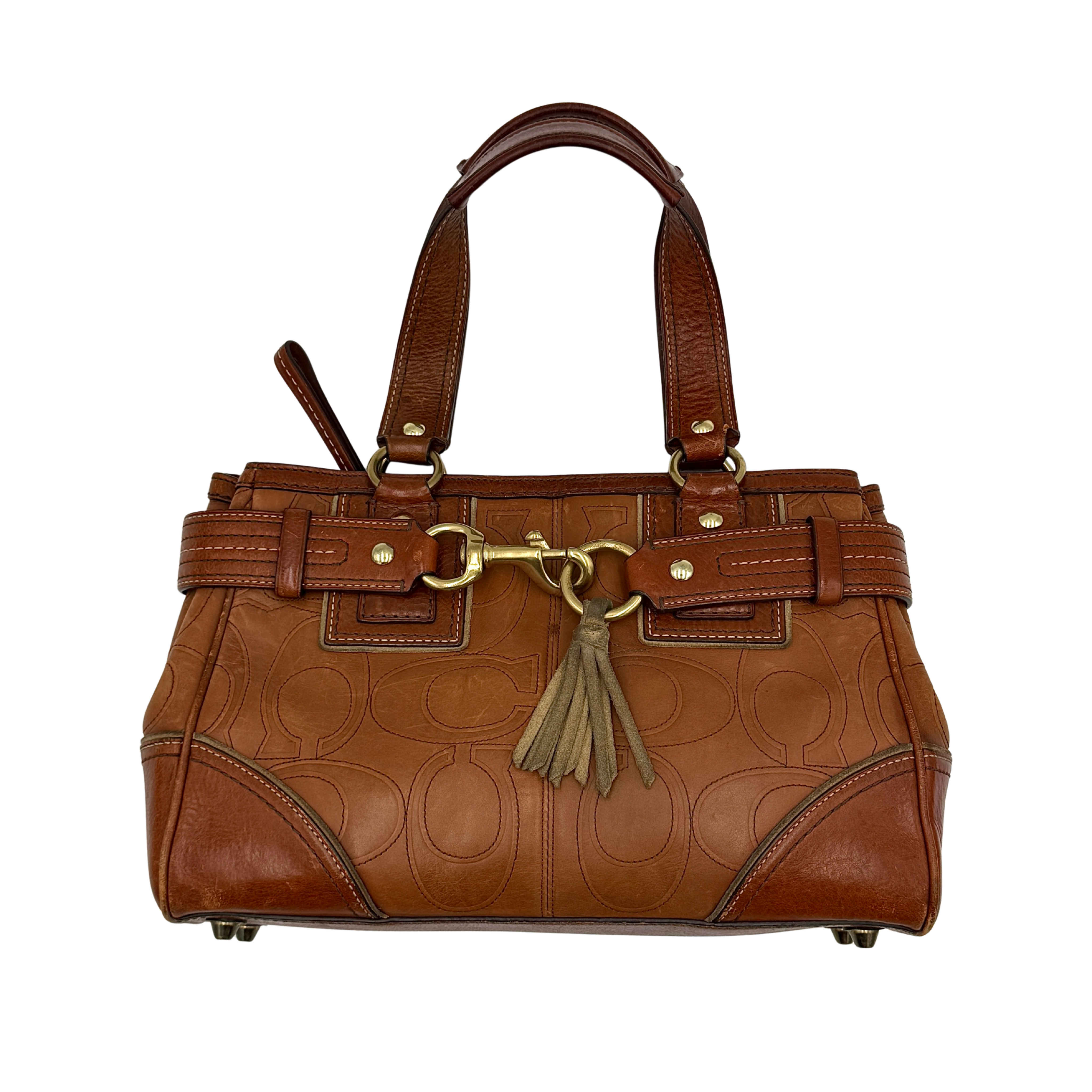 Coach Signature Hampton embossed shoulder bag in brown with gold-tone hardware and tassel detail, spacious and stylish design.