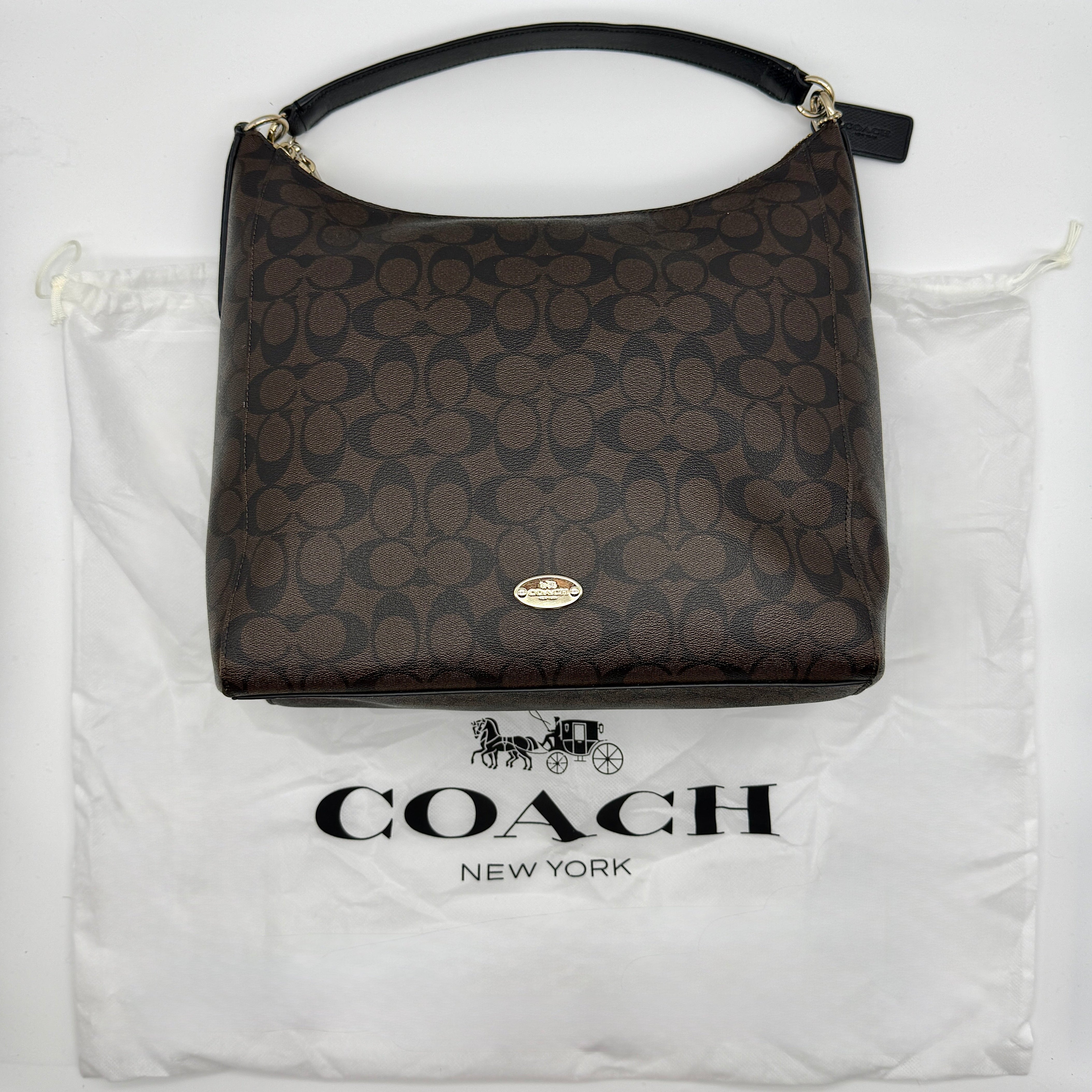 Coach Signature Hobo PVC Shoulder Bag in brown coated canvas with leather trim, gold-tone hardware, and original dust bag.