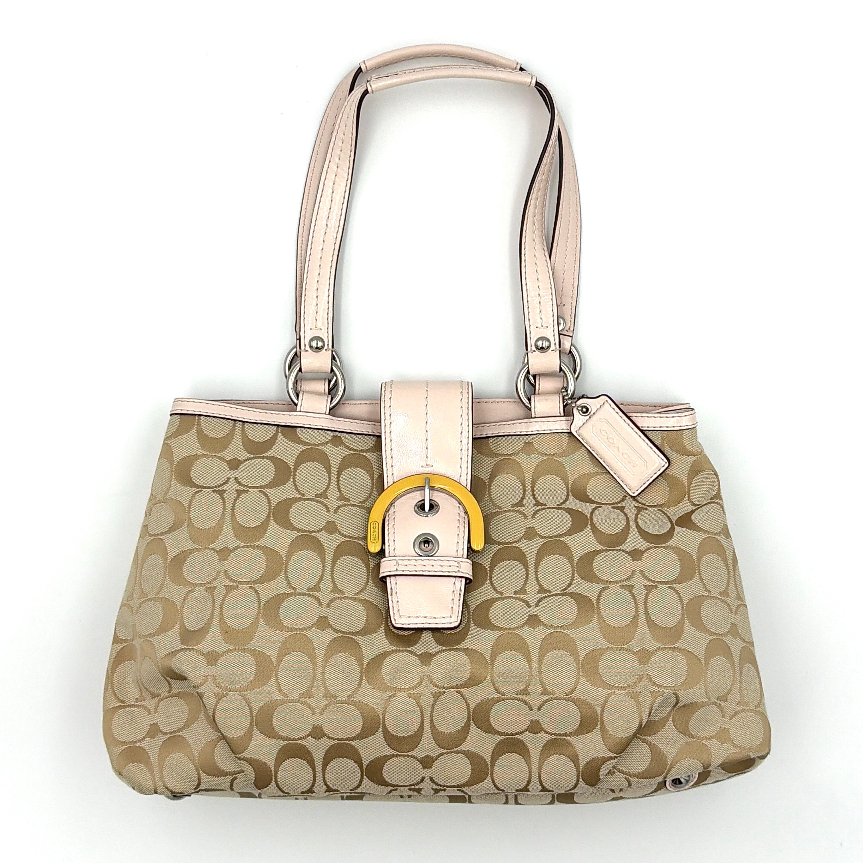 Coach Y2K Signature Soho East West Shoulder Bag in beige with baby pink leather trim, yellow accent buckle, and silver-tone hardware.