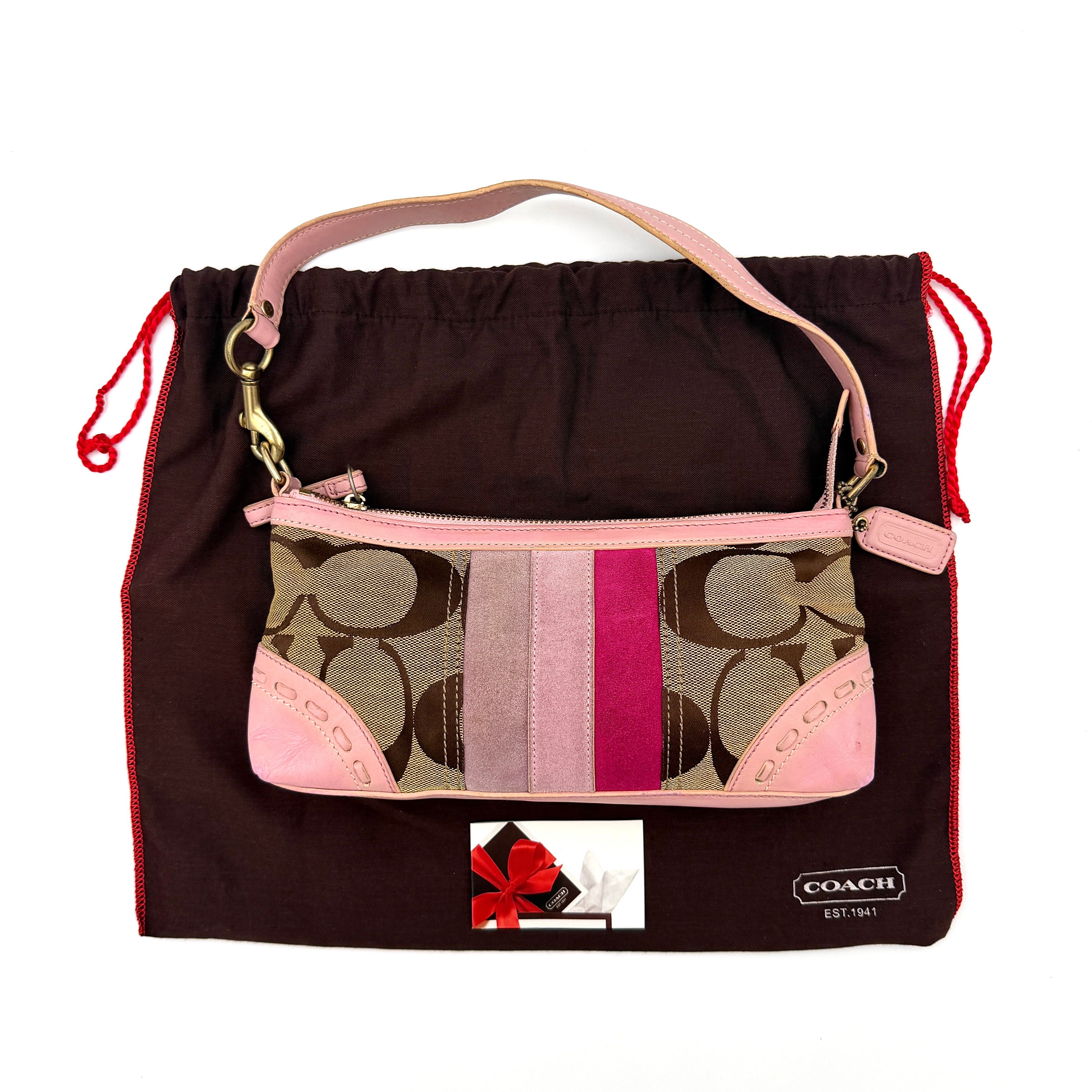 Coach Y2K Stripe Demi Baguette Shoulder Bag in pink and beige, featuring a signature stripe design and practical shoulder strap.