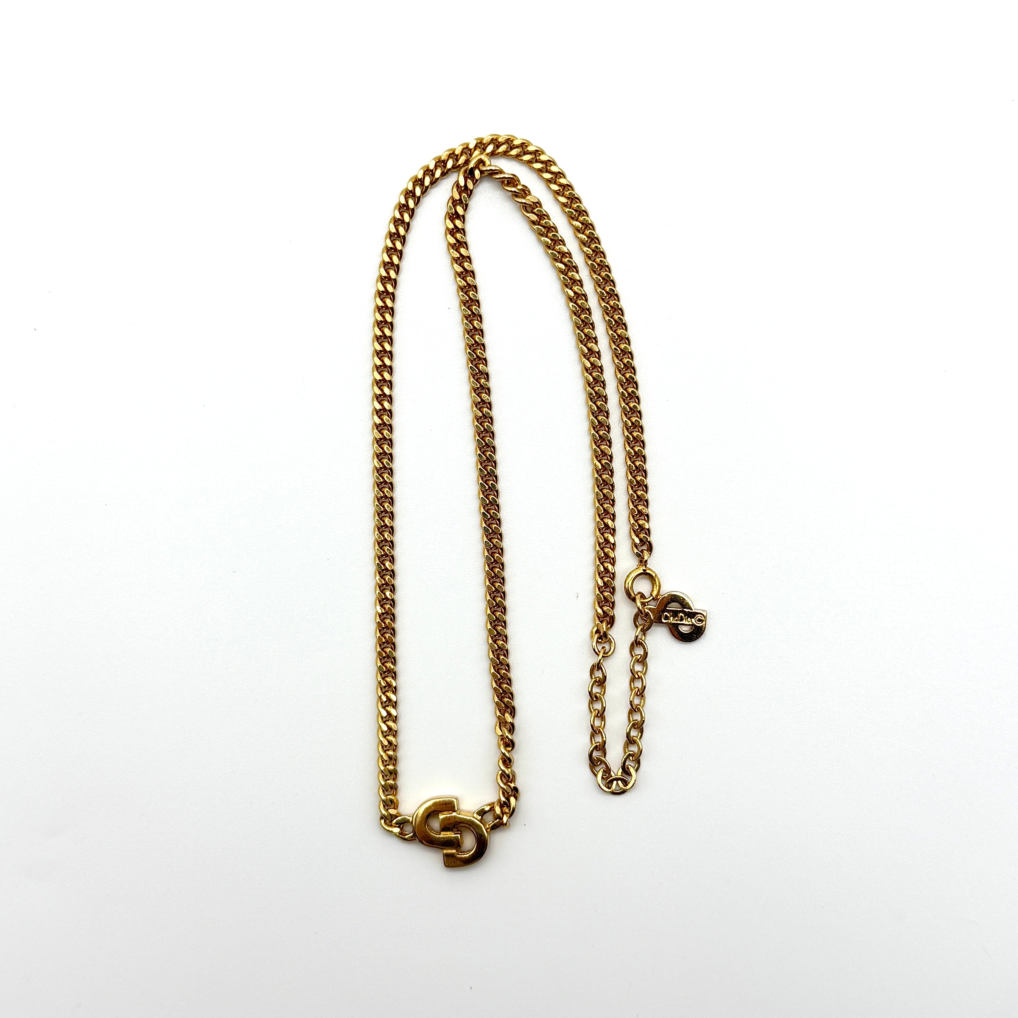 Dior CD Logo Necklace Gold-tone metal with interlocking CD pendant on an adjustable gold chain.