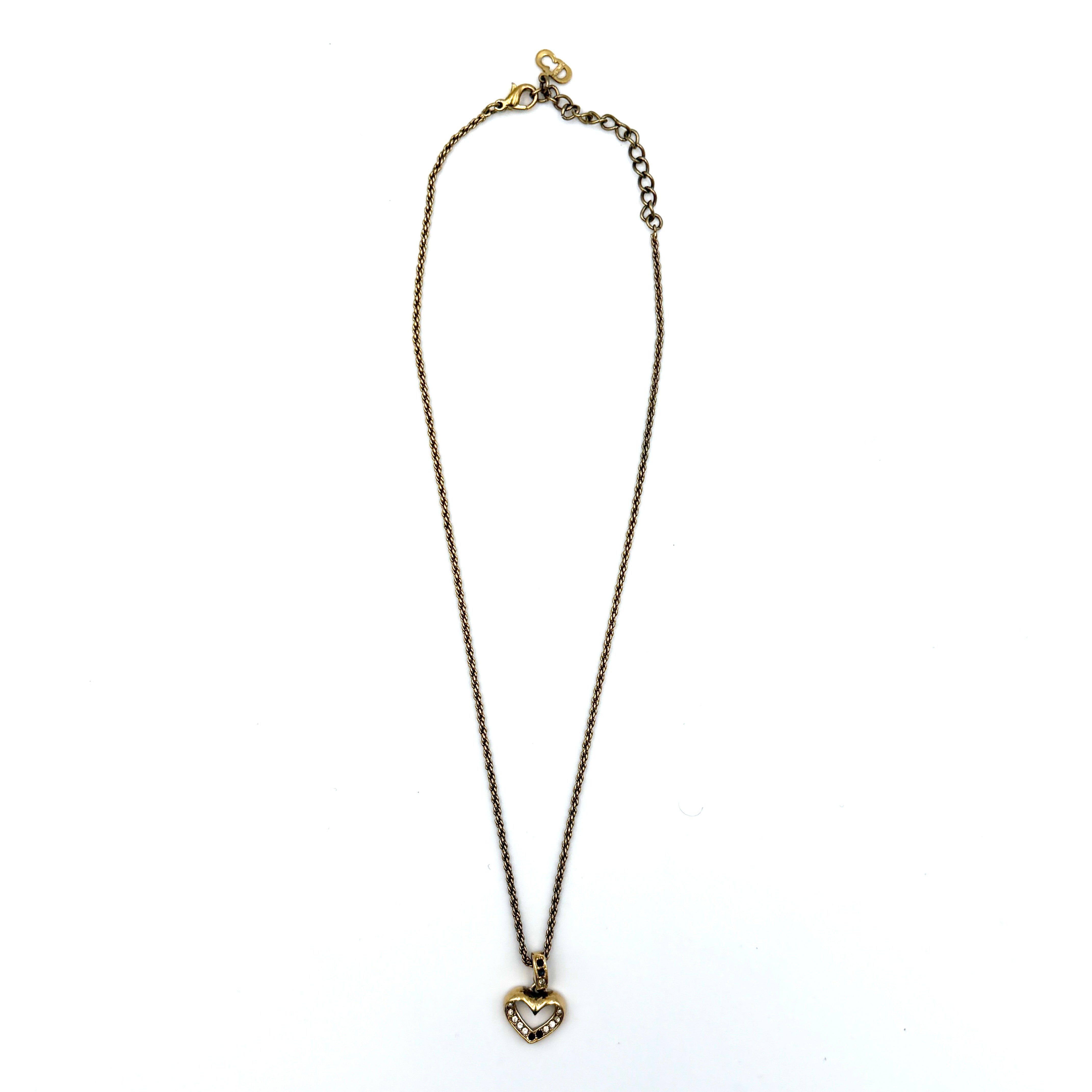 Dior heart rhinestone necklace in gold tone featuring an open heart pendant with sparkling crystal details.
