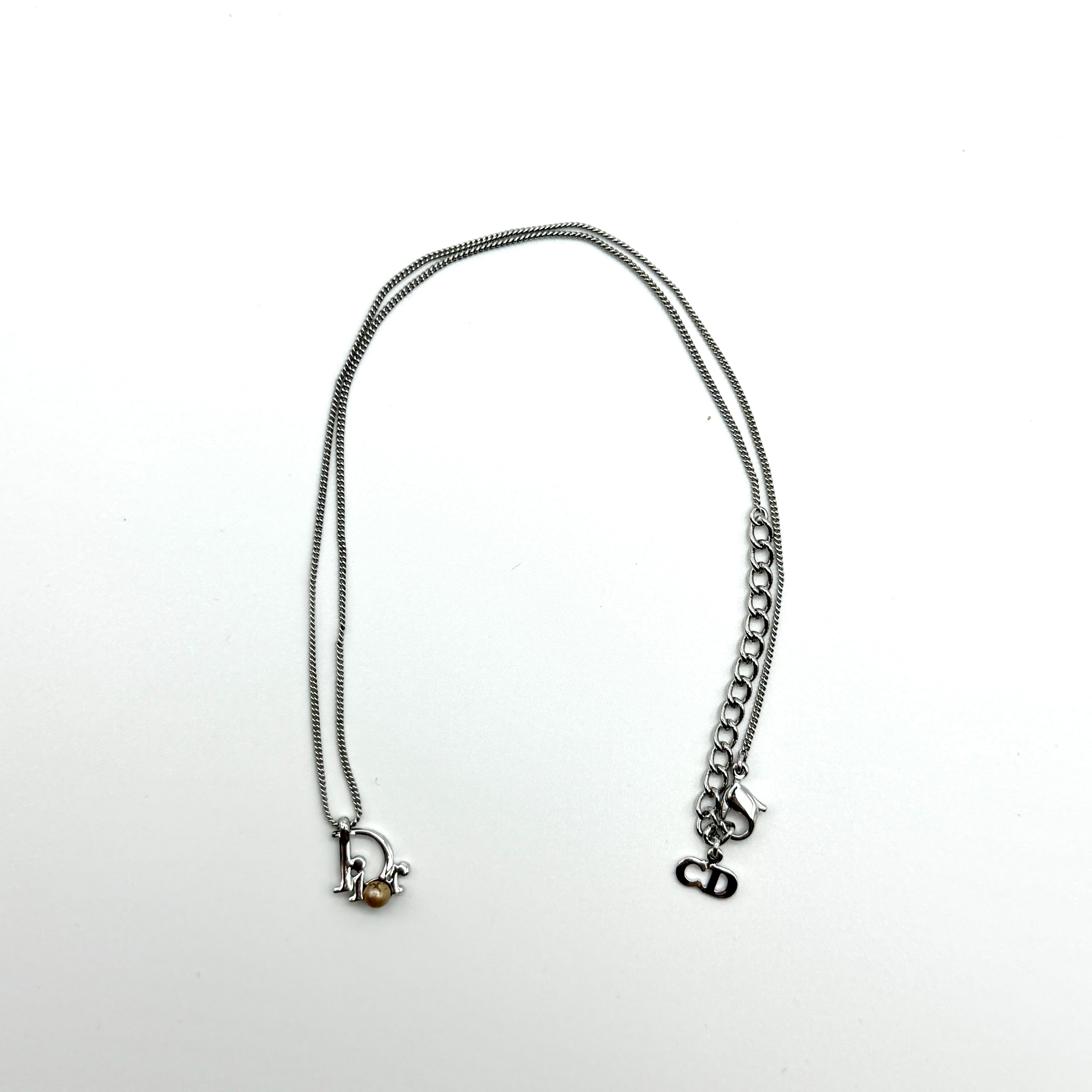 Dior Logo Pearl Preloved Luxury Necklace in silver-tone metal with pearl accent and CD charm clasp.