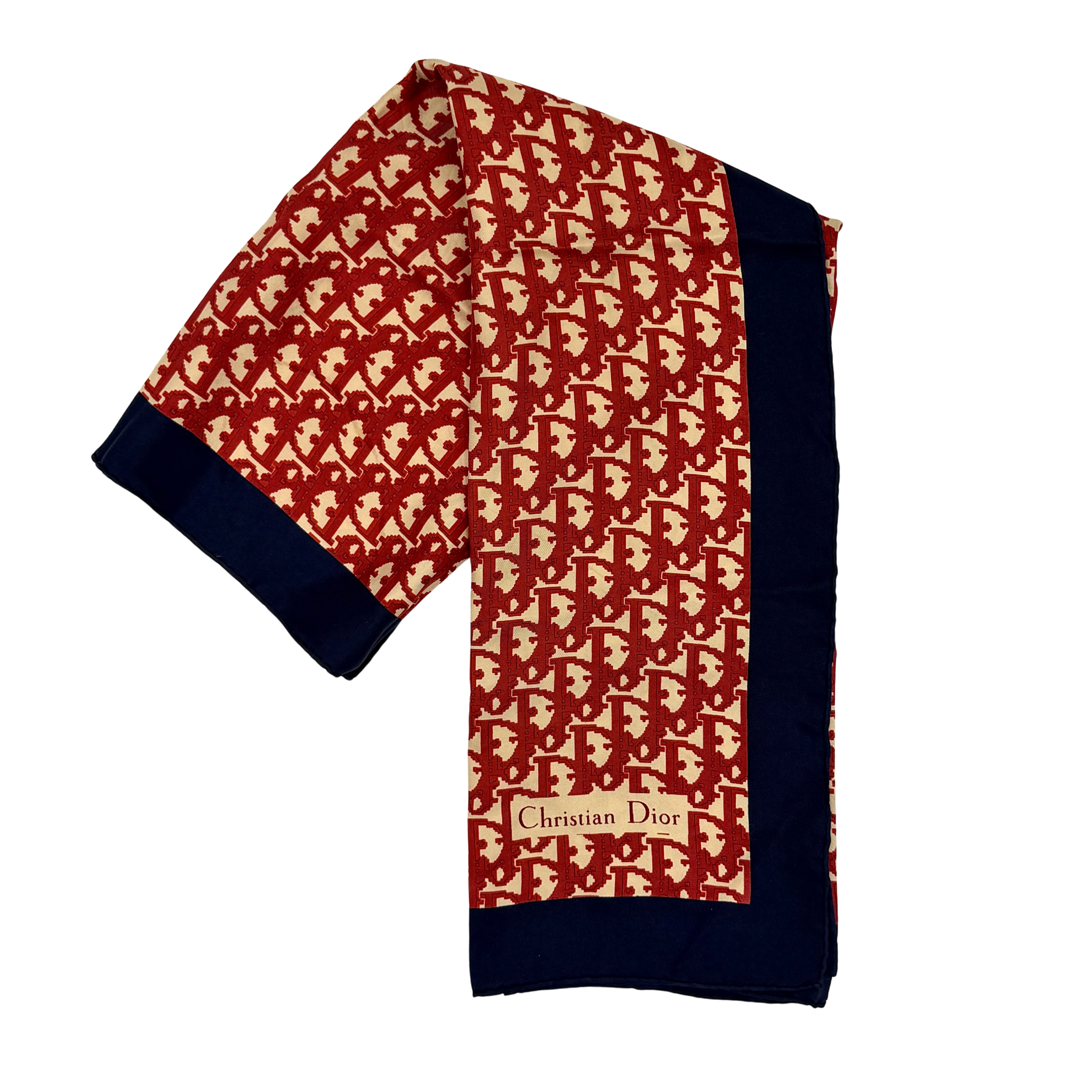 Dior monogram silk scarf in red with navy border and Christian Dior signature, shown folded, full layout, and close-up of logo detail.
