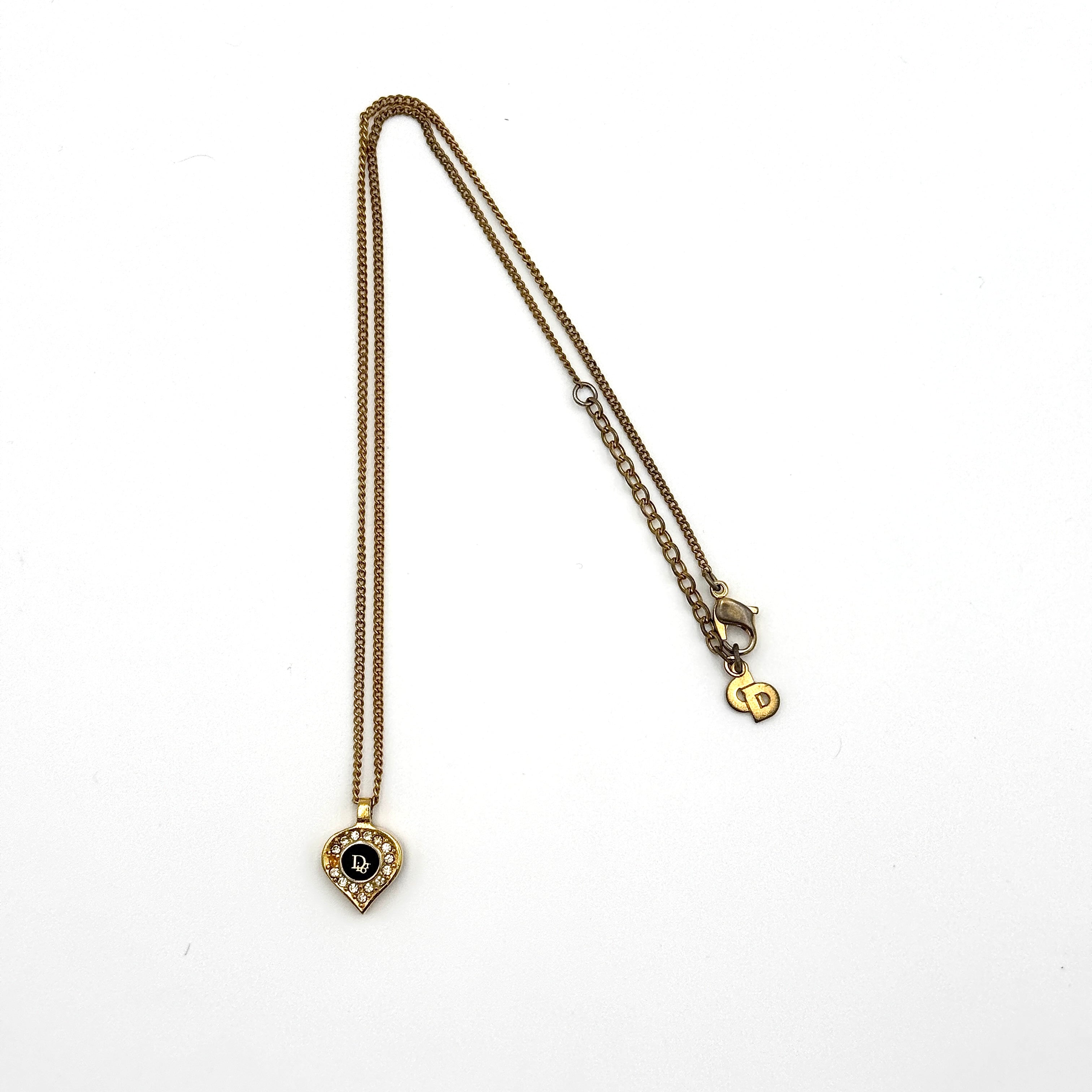Dior Rhinestone Necklace Gold, featuring a teardrop pendant with black centre and crystal accents on a gold-tone chain