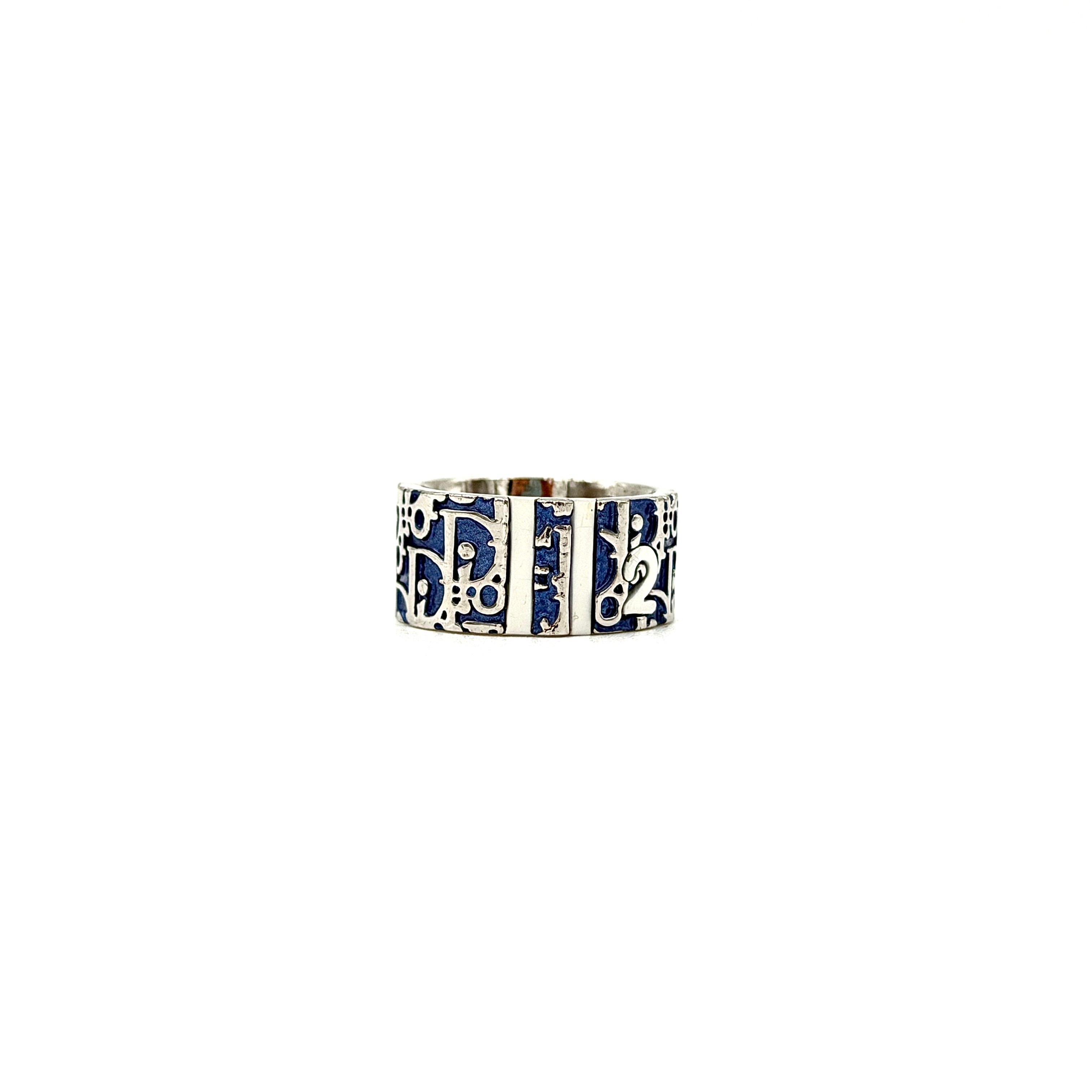 Dior Trotter ring in blue enamel with silver-tone band featuring the iconic Dior monogram pattern.