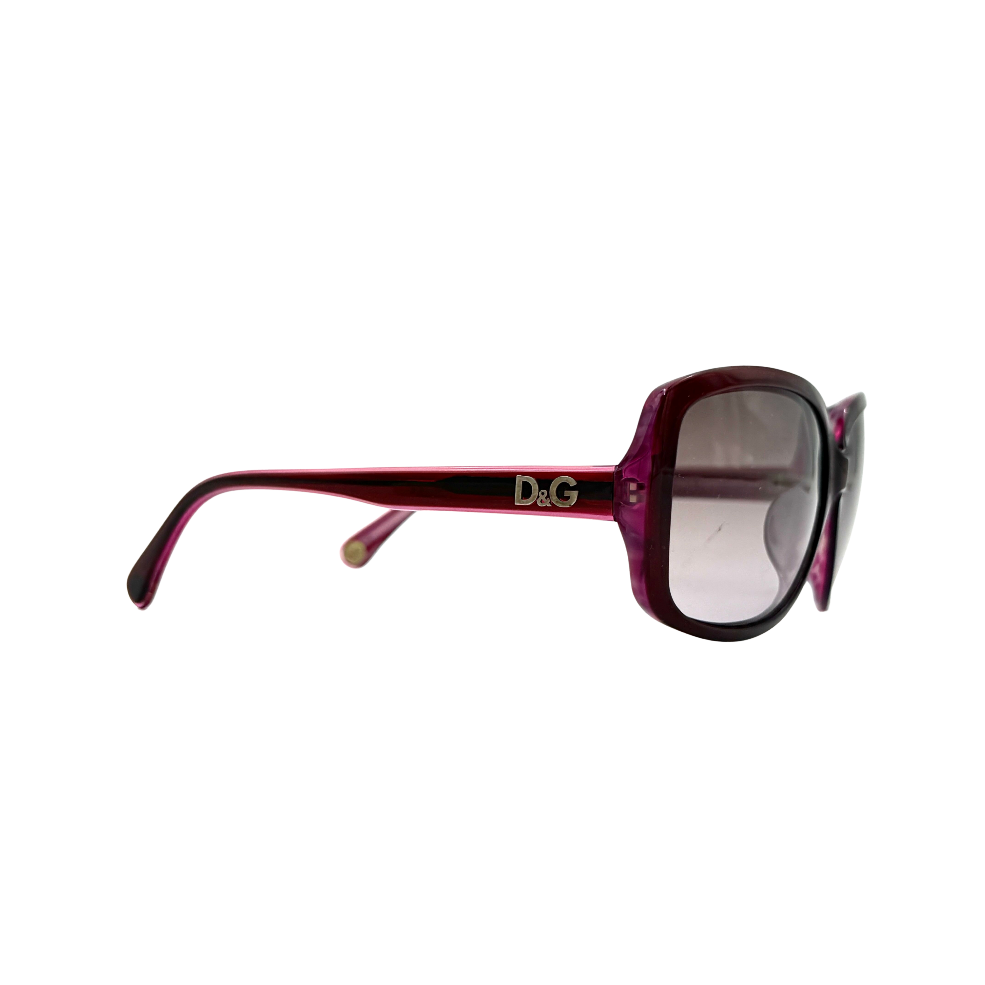 Dolce & Gabbana D&G3054 sunglasses in purple with soft square frames and D&G logo at the temple, shown with protective case.
