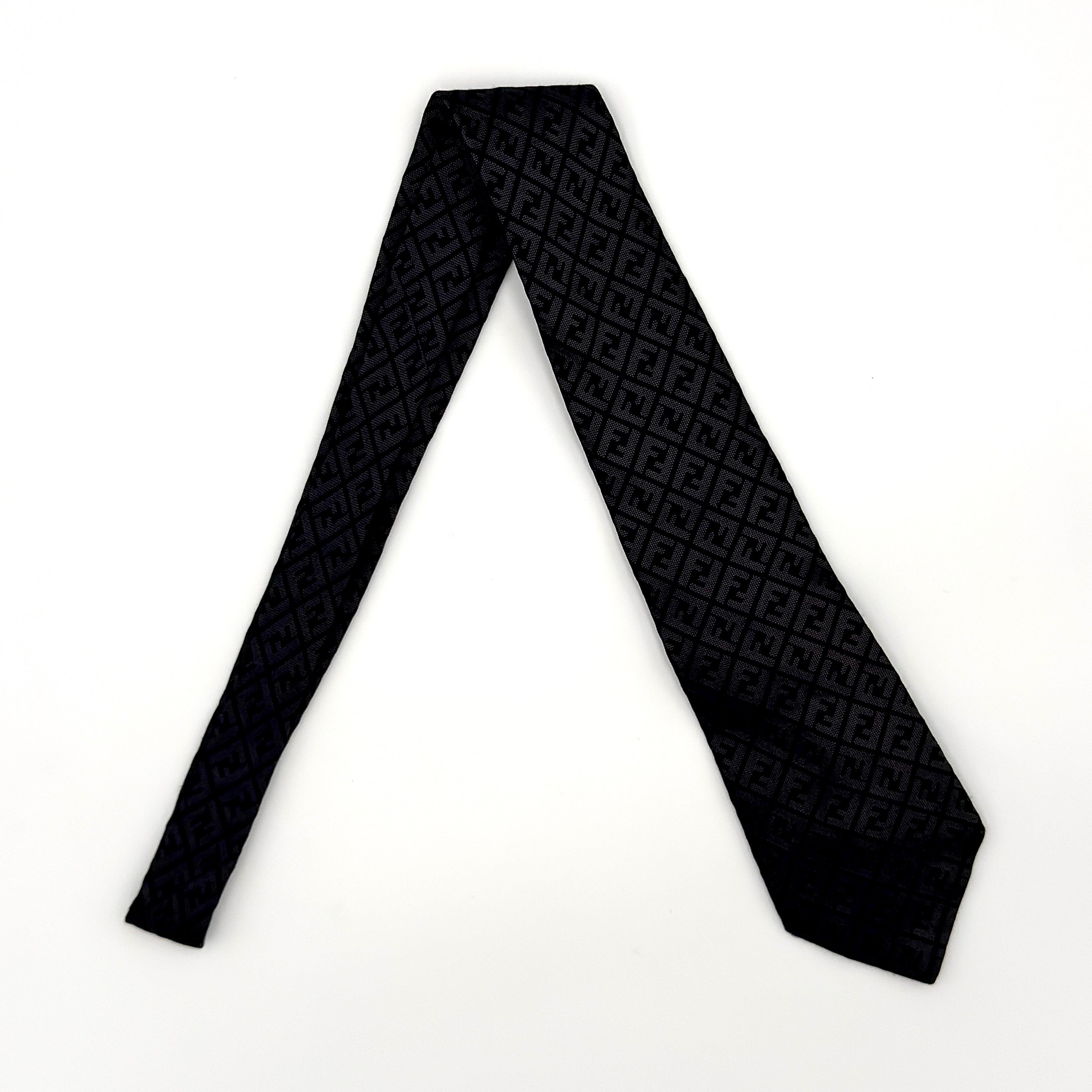 Fendi black silk tie with subtle FF Zucca monogram woven pattern.