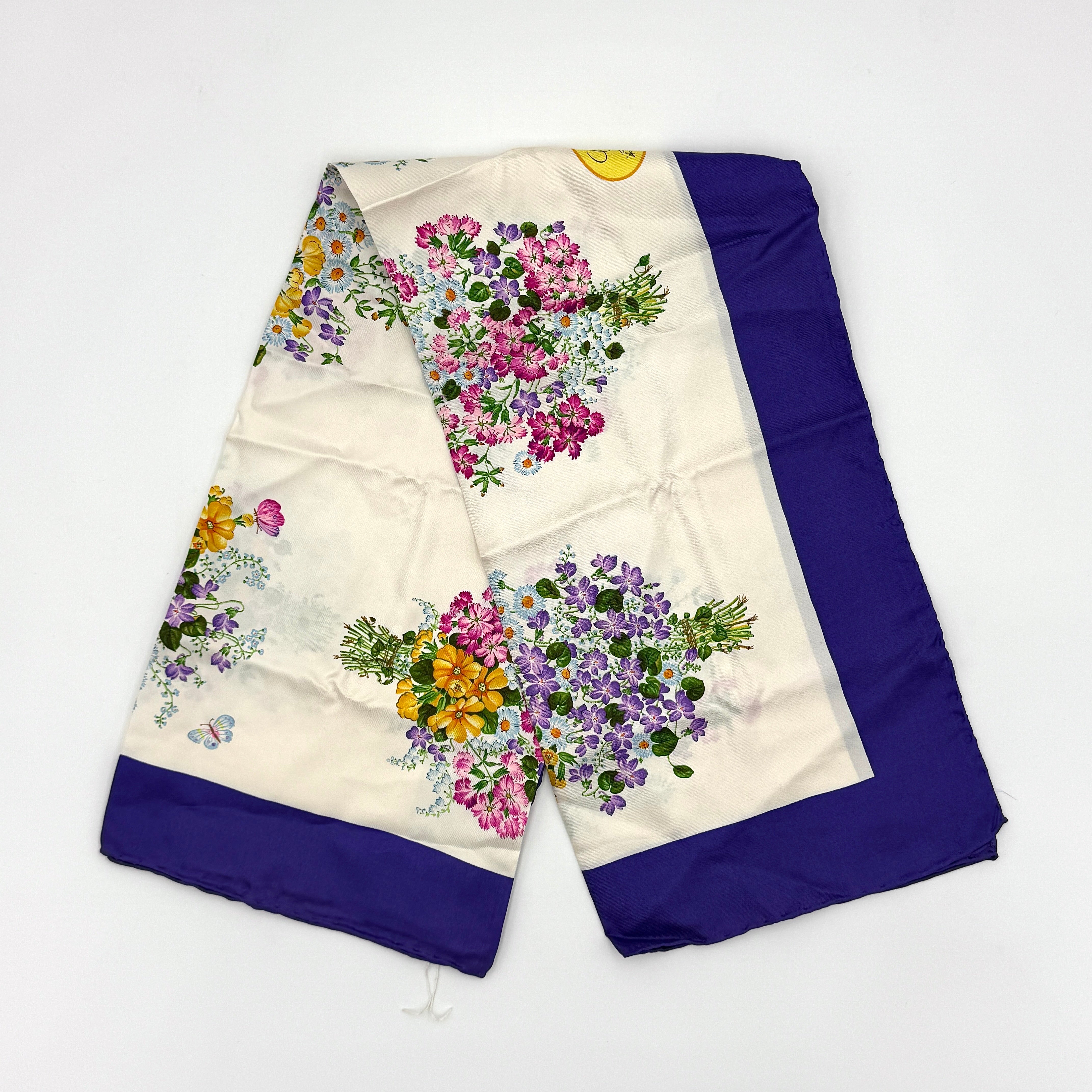Gucci Flora silk scarf in blue multicolor with vibrant floral patterns and a luxurious silk fabric
