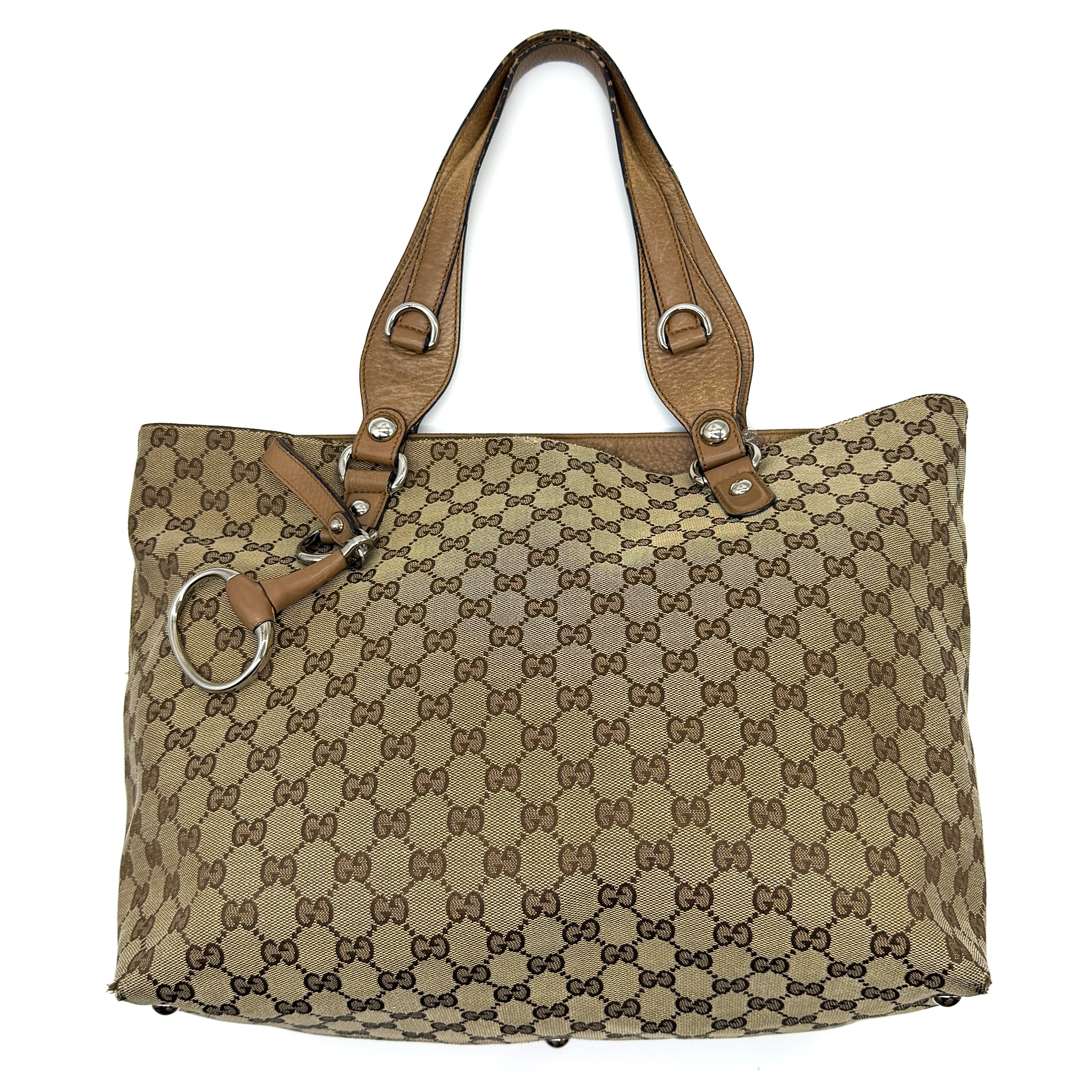 Gucci GG Monogram Icon Bit Shoulder Bag in beige/brown canvas with tan leather trim and silver-tone ring hardware.