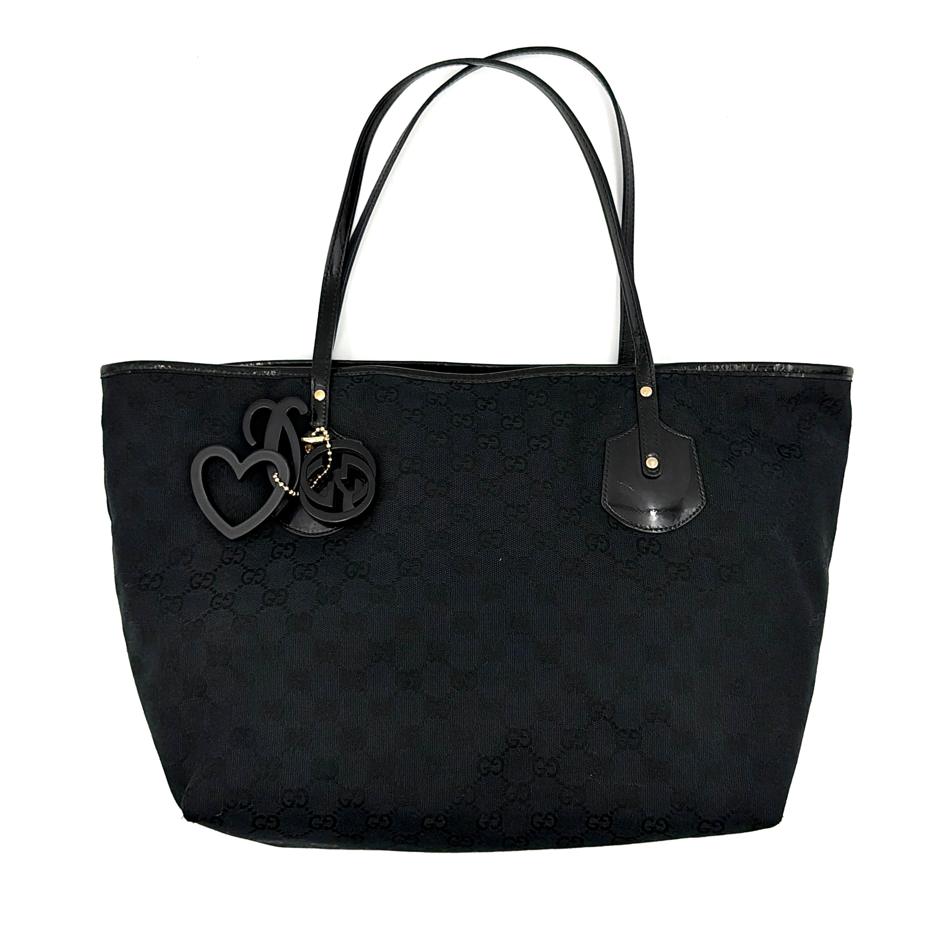 Gucci GG Monogram Jolie Shoulder Bag in black canvas with black leather trim and resin charms.