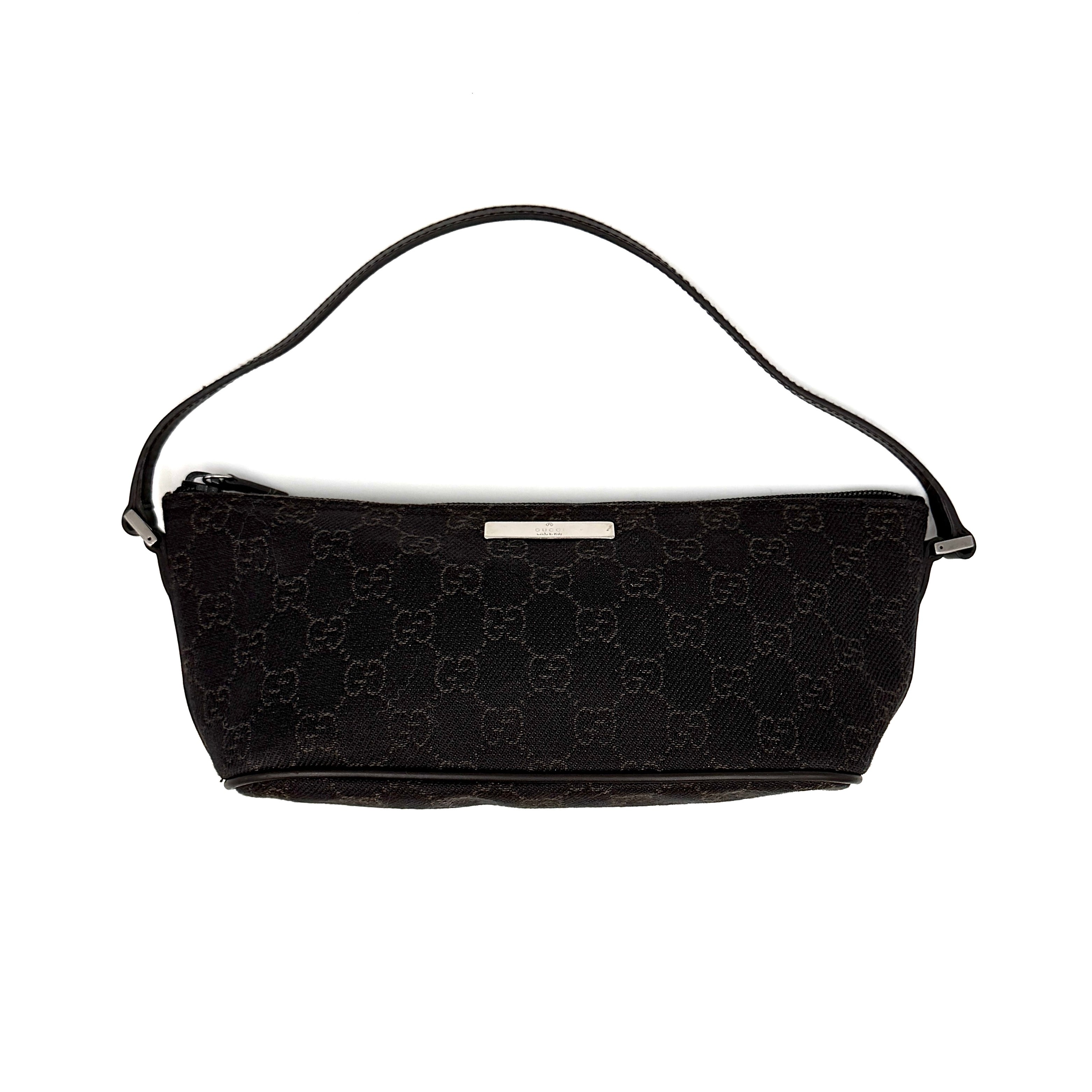 Gucci GG monogram pochette boat shoulder bag in black canvas with leather trim and silver-tone logo plaque.