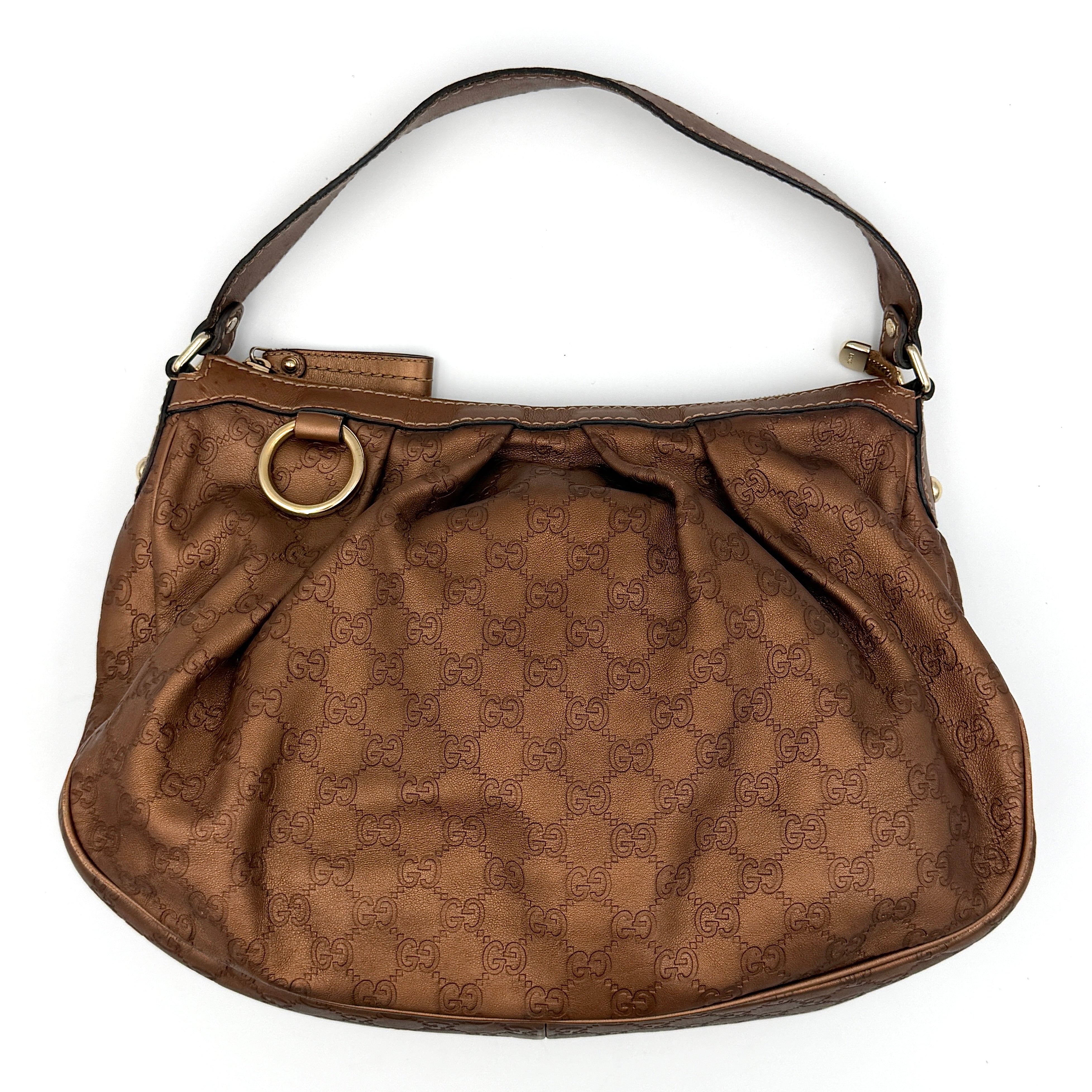 Gucci GG monogram Sukey hobo shoulder bag in brown canvas shown from the front with gathered top edge and leather shoulder strap