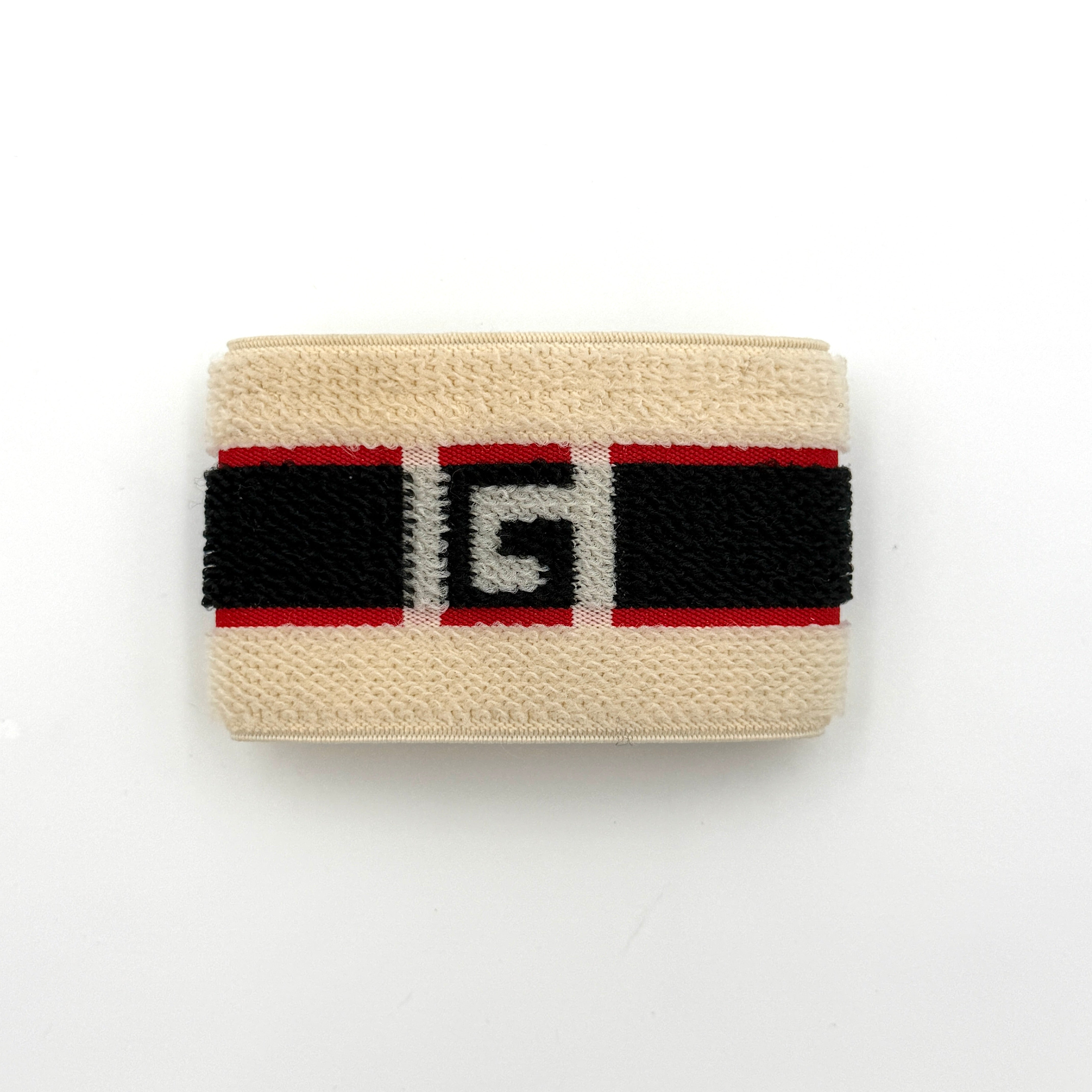 Gucci logo stripe web sports wristband in beige featuring the iconic Gucci G emblem and web stripe design.
