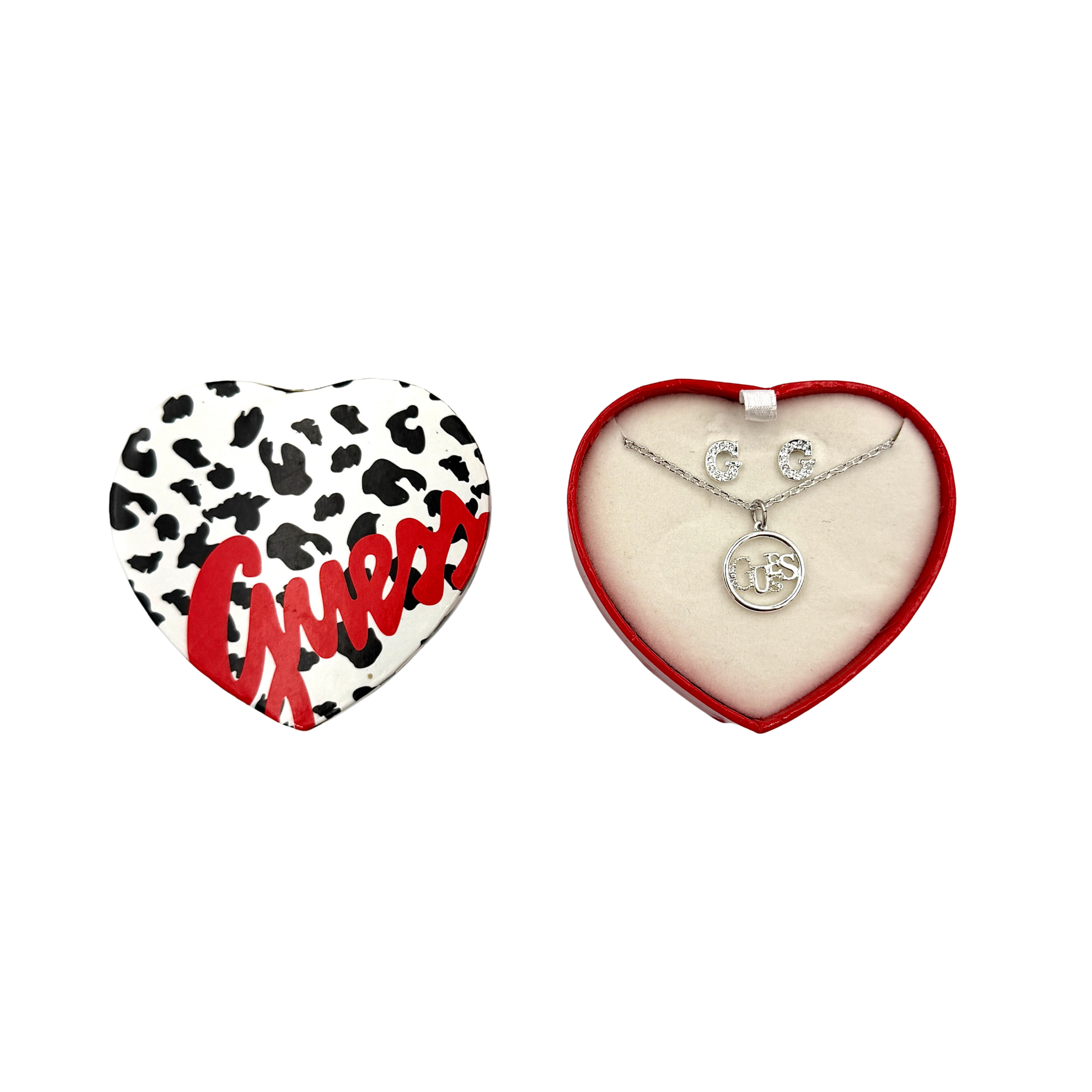Guess silver-tone heart necklace and matching earrings set, shown with branded heart case and close-up of pendant and earrings.
