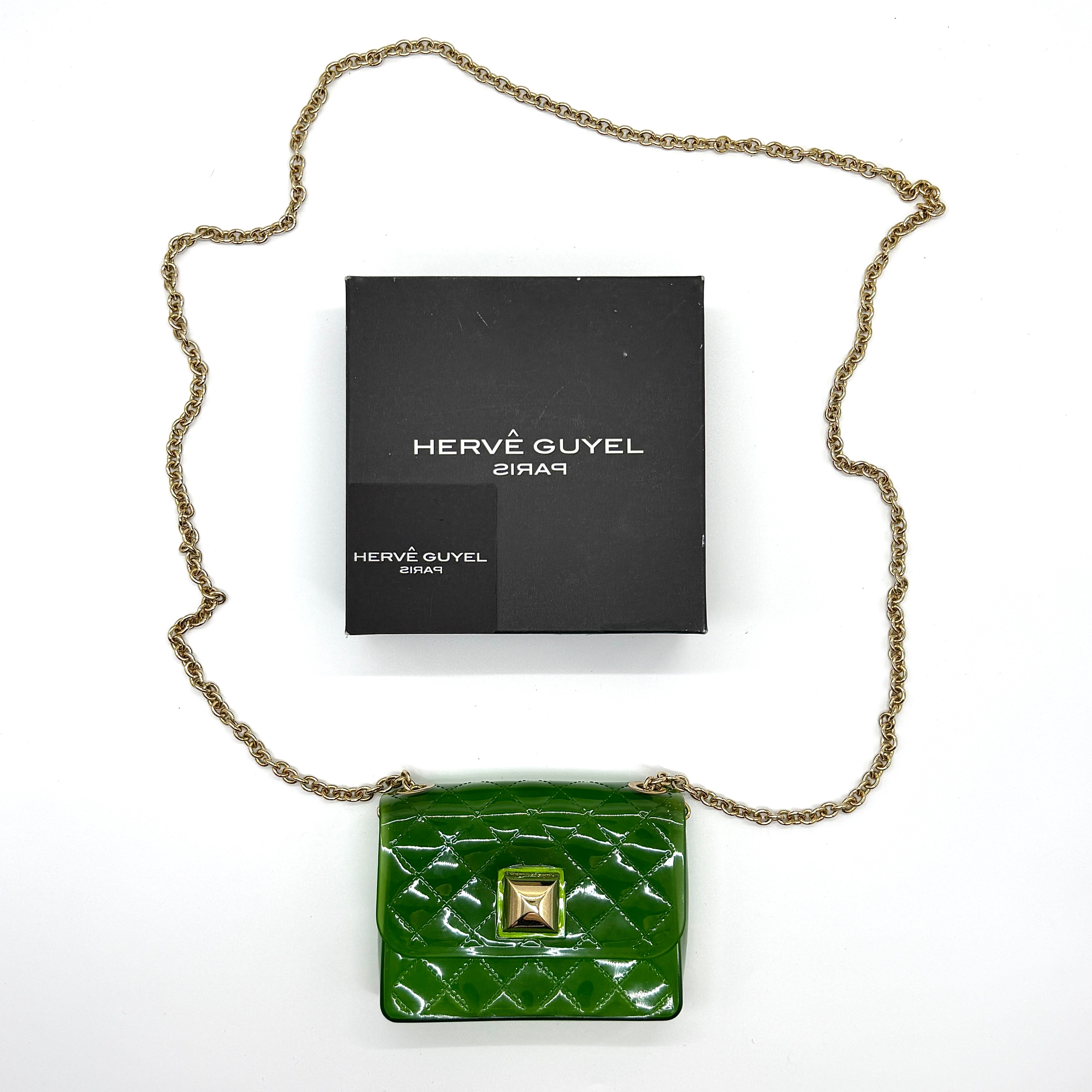Hervé Guyel Jelly Mini Crossbody Bag in translucent green with quilted texture, gold-tone chain strap, and pyramid stud closure.
