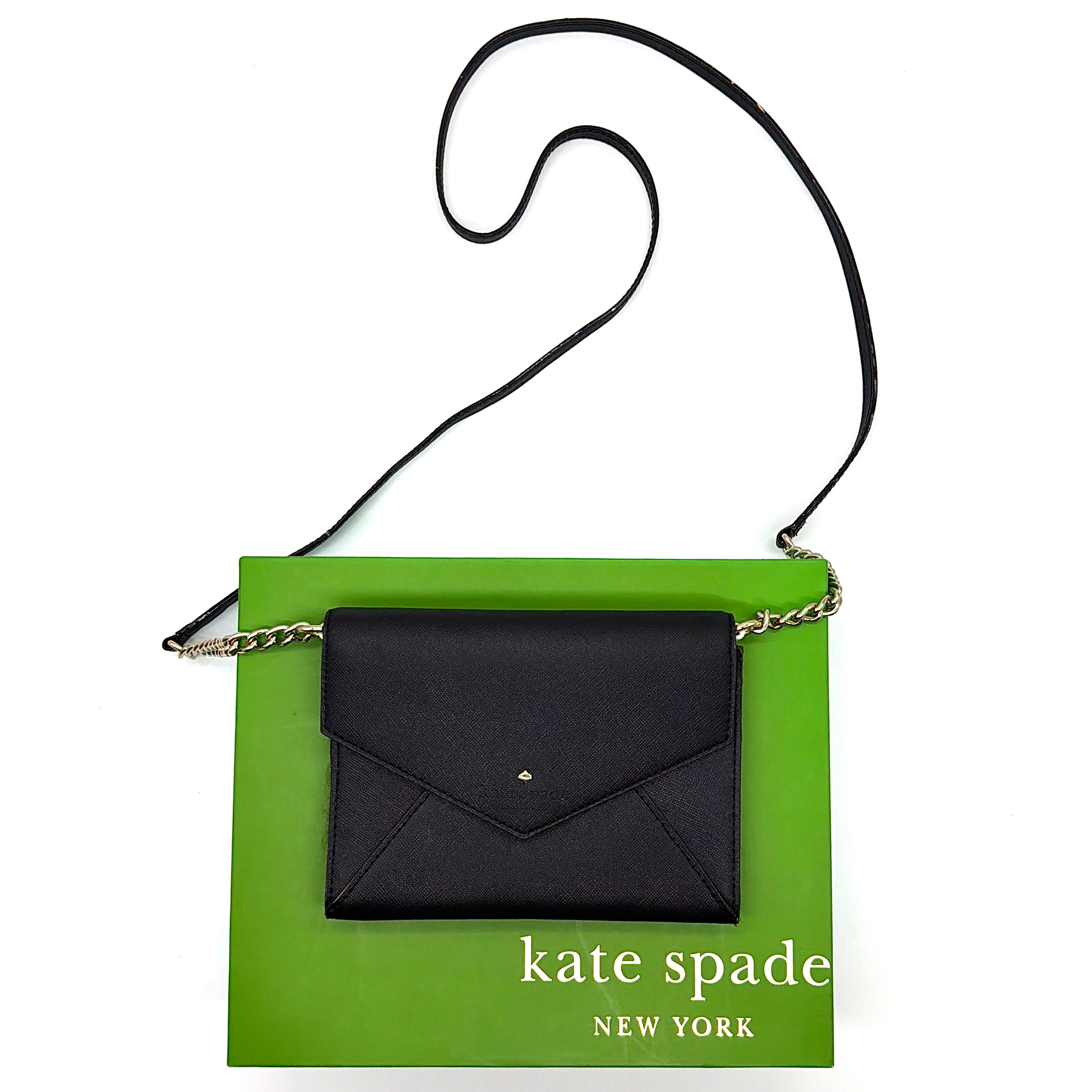 Kate Spade Cedar Street Monday Envelope Crossbody Bag in black saffiano leather with gold-tone chain strap and envelope flap.
