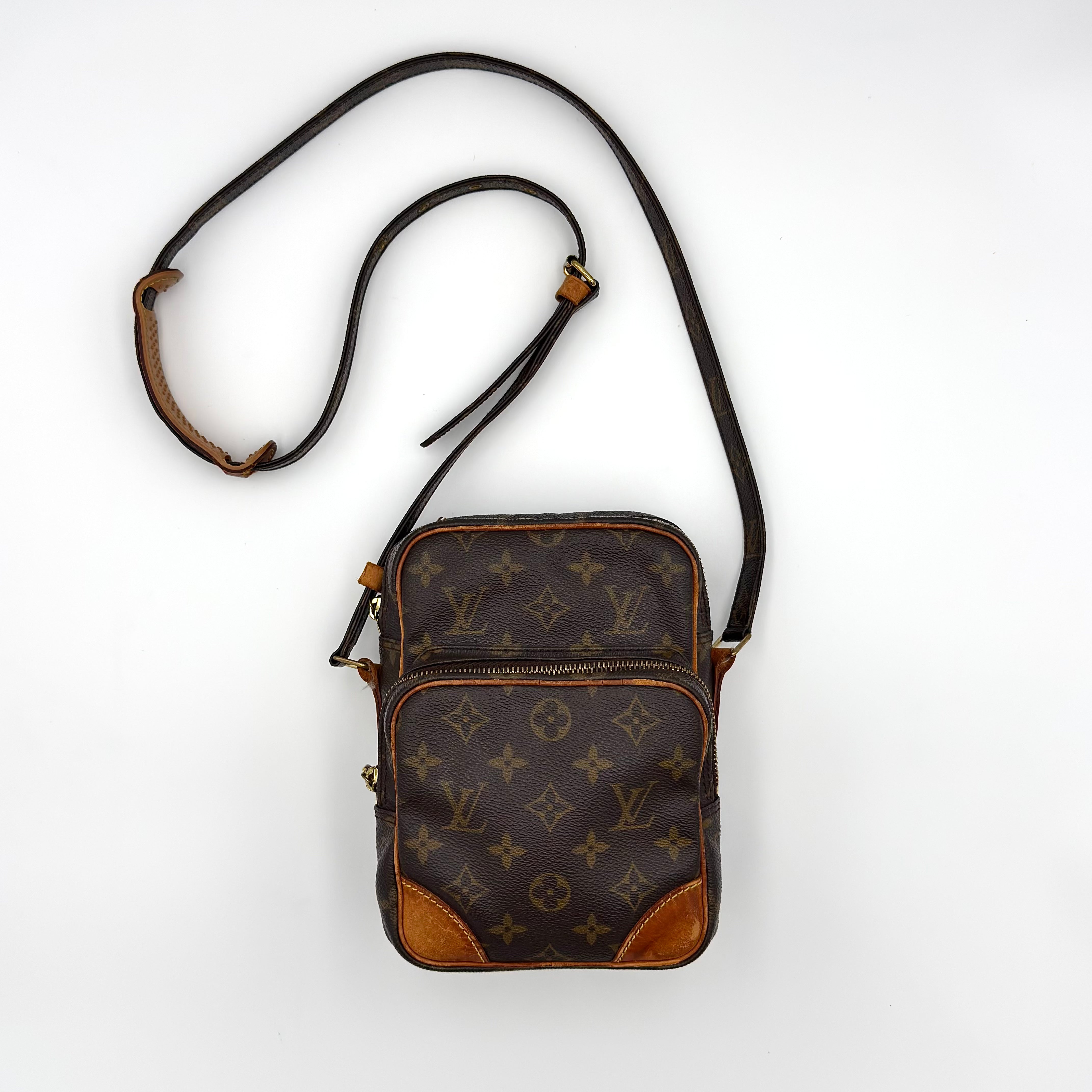 Discover the Louis Vuitton Monogram Amazon Crossbody Bag in brown monogram canvas with dual compartments and adjustable strap, available at Elevated Studios. Free delivery across Malaysia and worldwide shipping available.