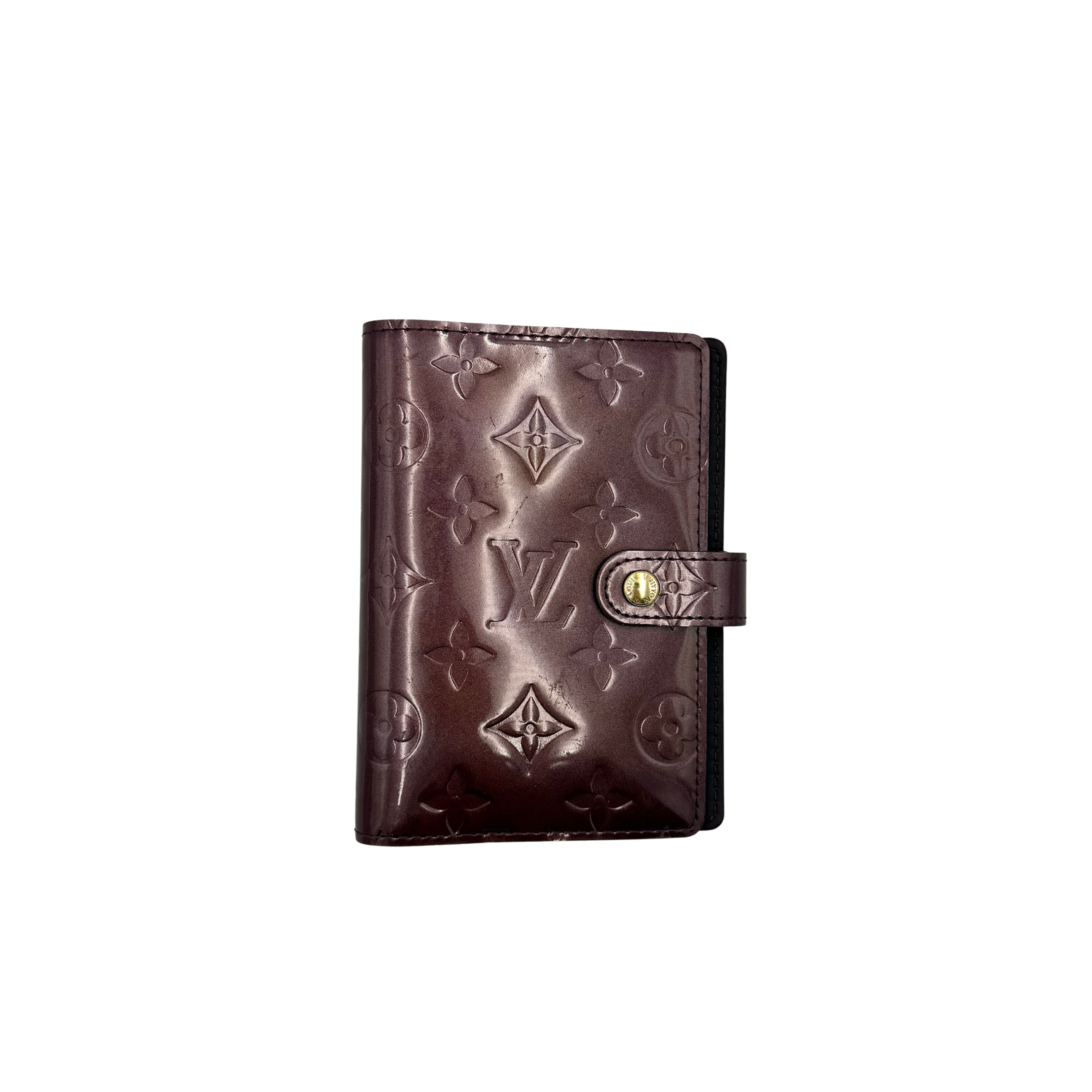 Louis Vuitton Monogram Vernis PM Agenda in burgundy patent leather with monogram pattern, featuring a snap closure and internal card slots.
