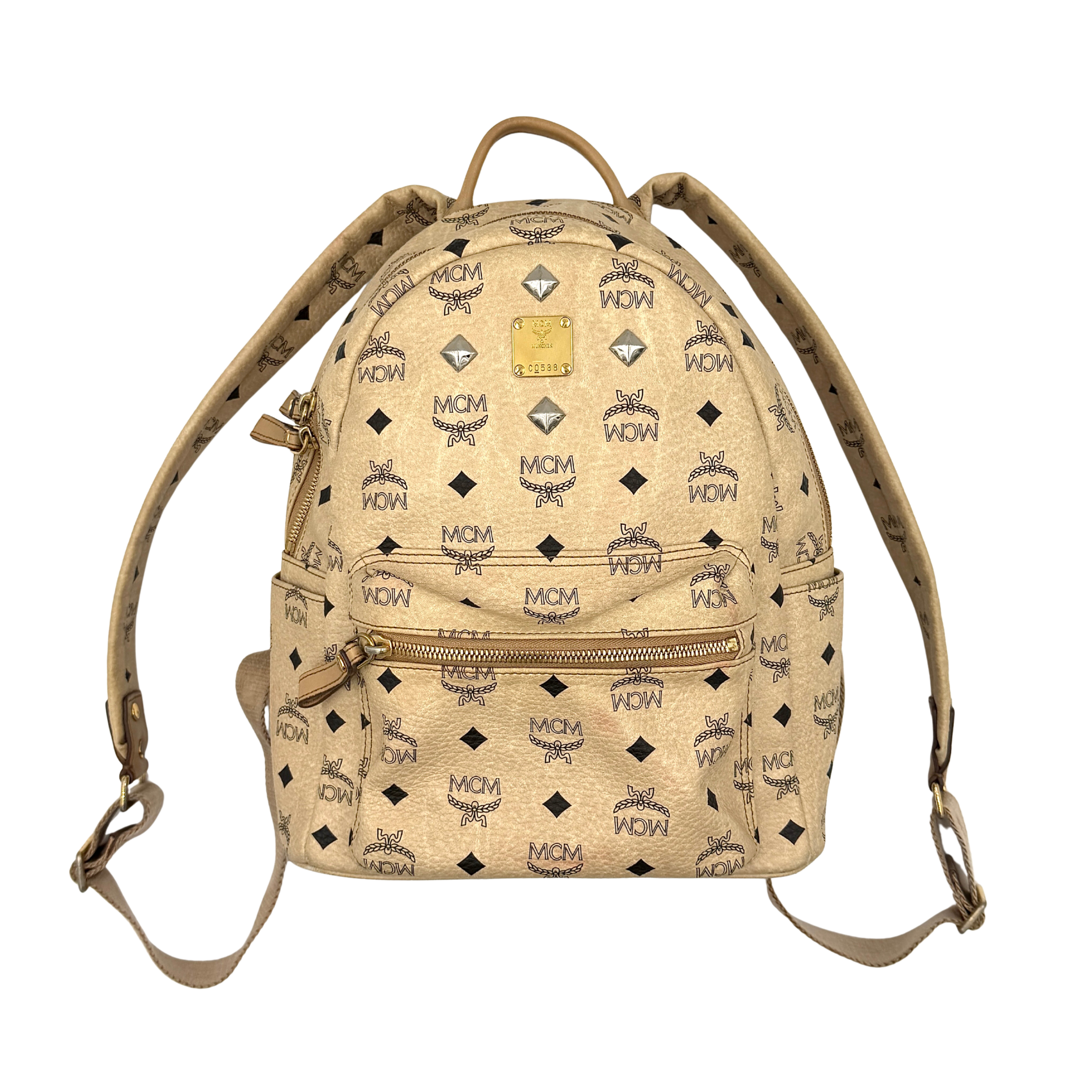 MCM beige Visetos Stark leather backpack with signature monogram pattern, front zip pocket, and adjustable straps.