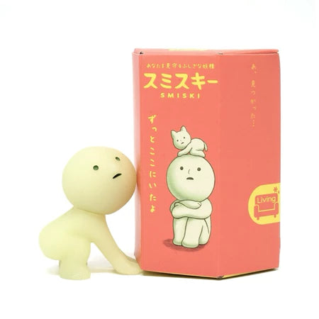 Smiski collectible figure, glow-in-the-dark mini character in quirky poses, perfect for shelves and desks.