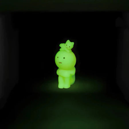 Smiski collectible figure, glow-in-the-dark mini character in quirky poses, perfect for shelves and desks.