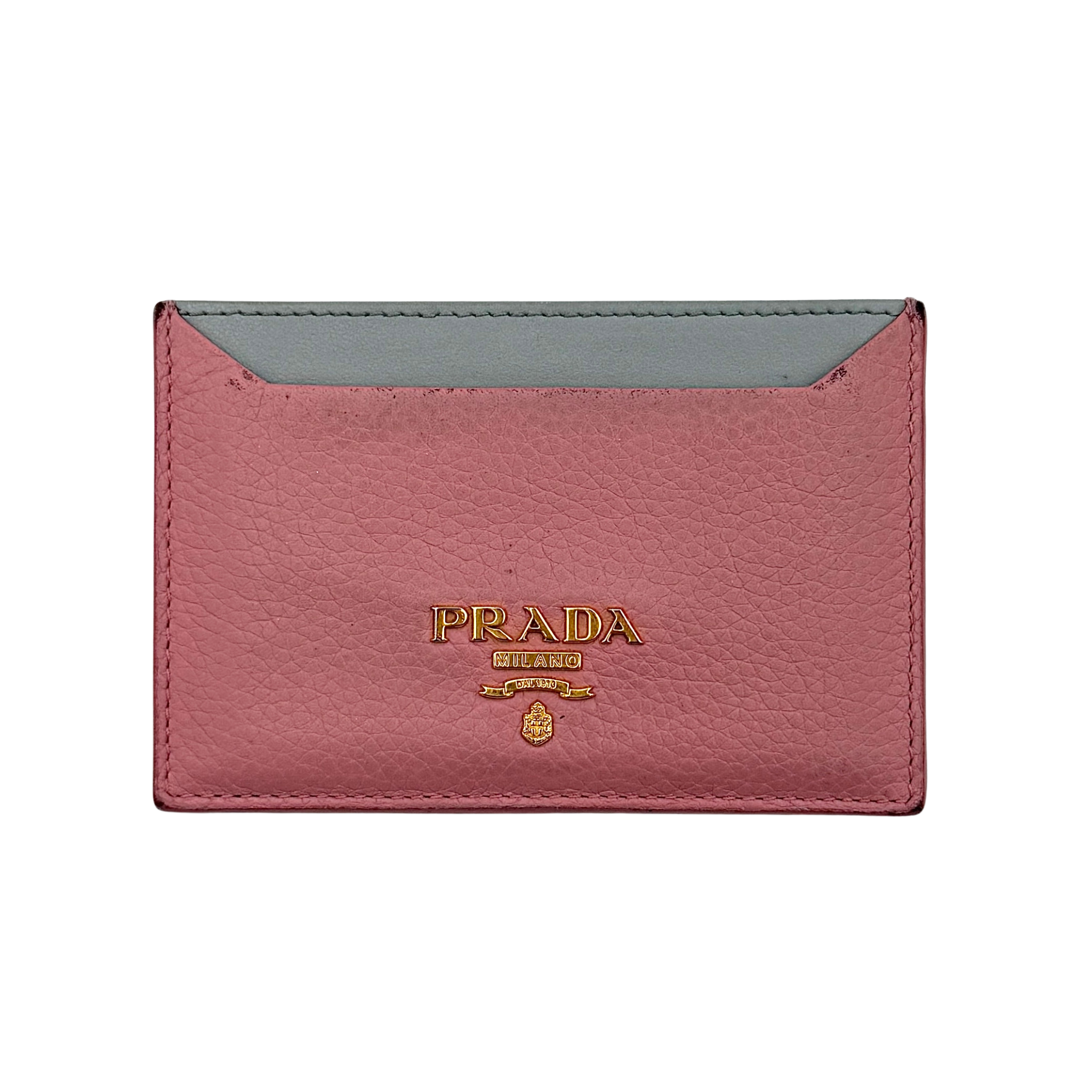 Prada Daino colour cardholder in pink and grey grained leather featuring gold-tone Prada logo, slim silhouette, and card slots with a central slip pocket, shown with Prada box.