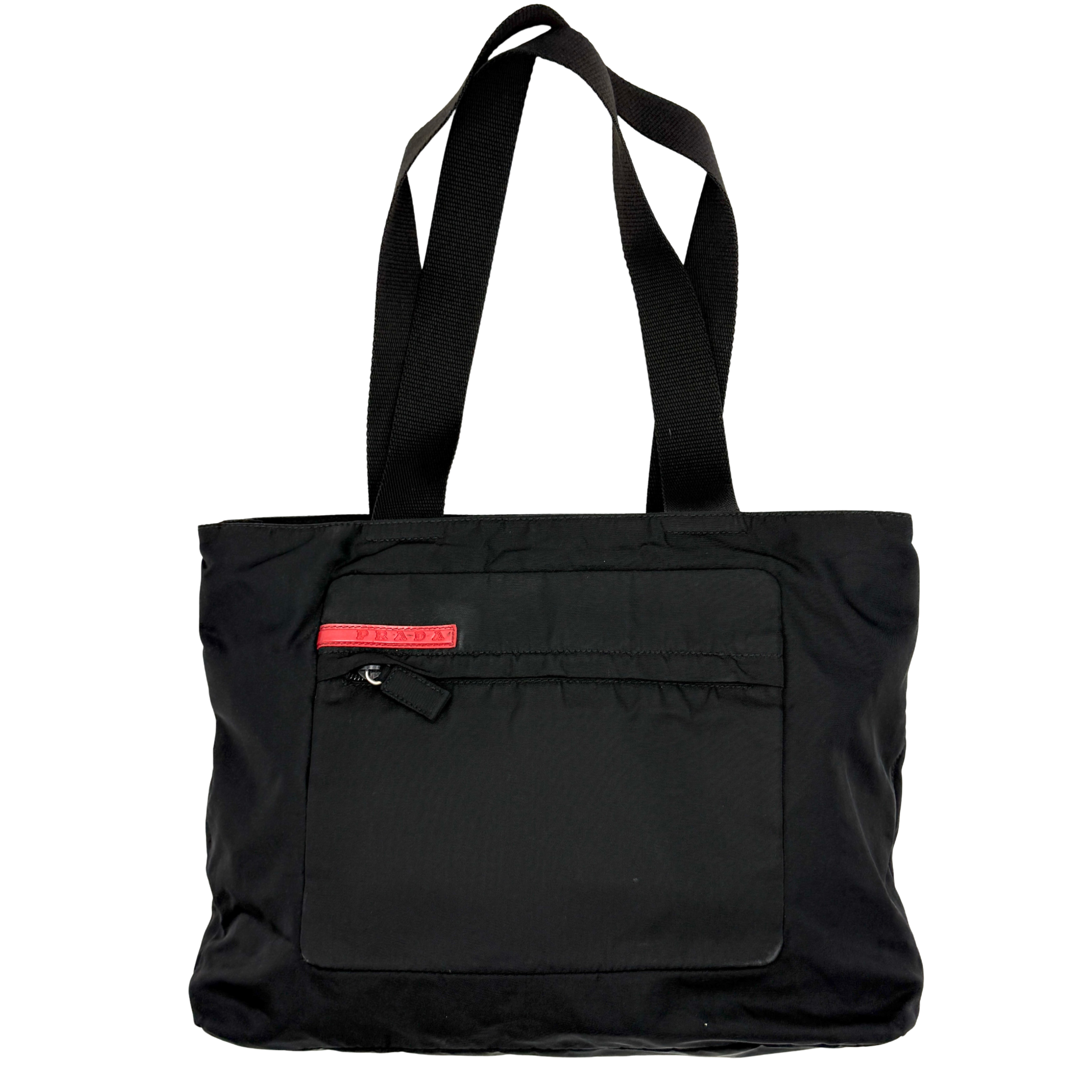 Prada Sport Tessuto Nylon Tote Bag in black with a red label and exterior pocket, featuring long black handles.