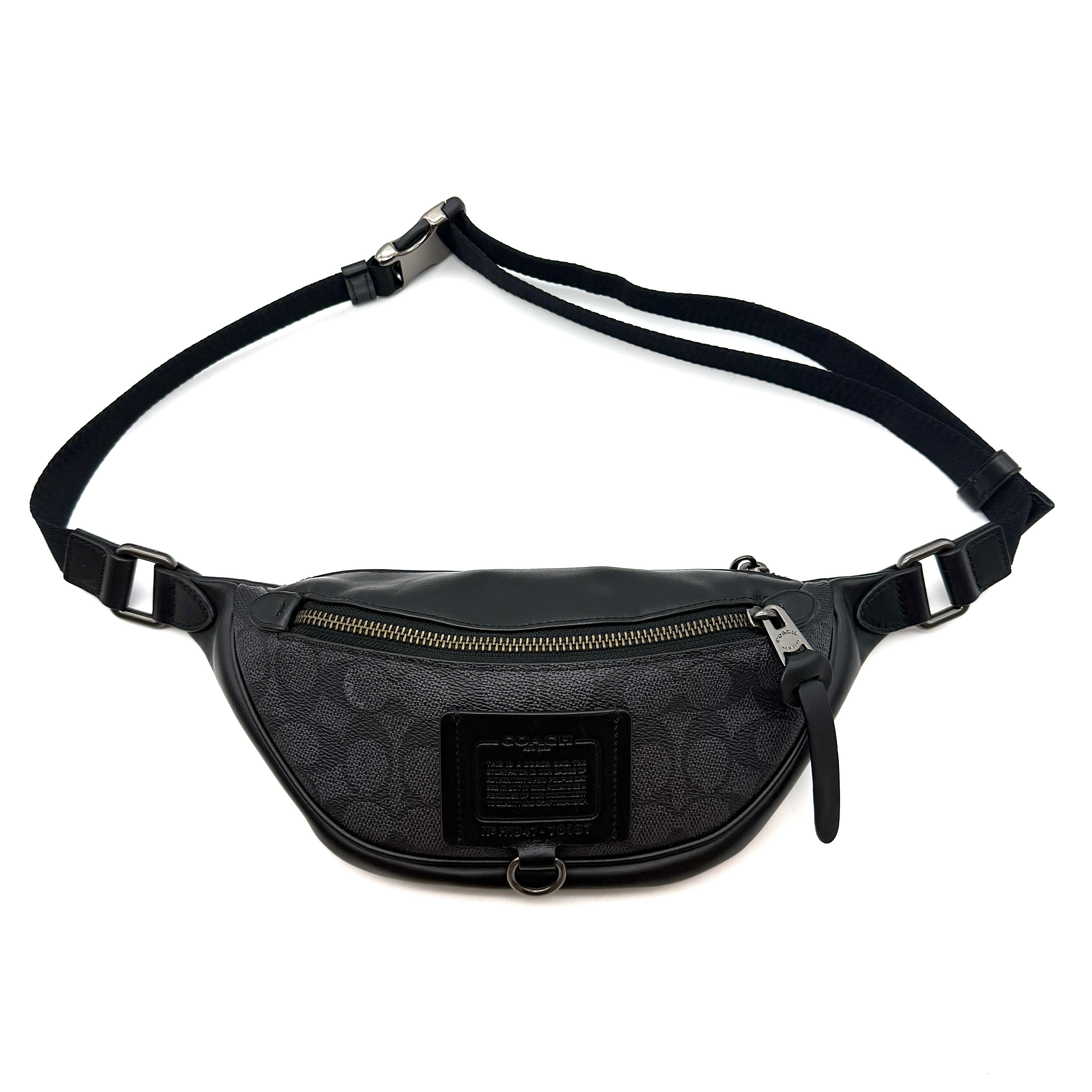 Coach Signature Rivington Belt Bag in black coated canvas with leather trim, gunmetal-tone hardware, and adjustable web strap