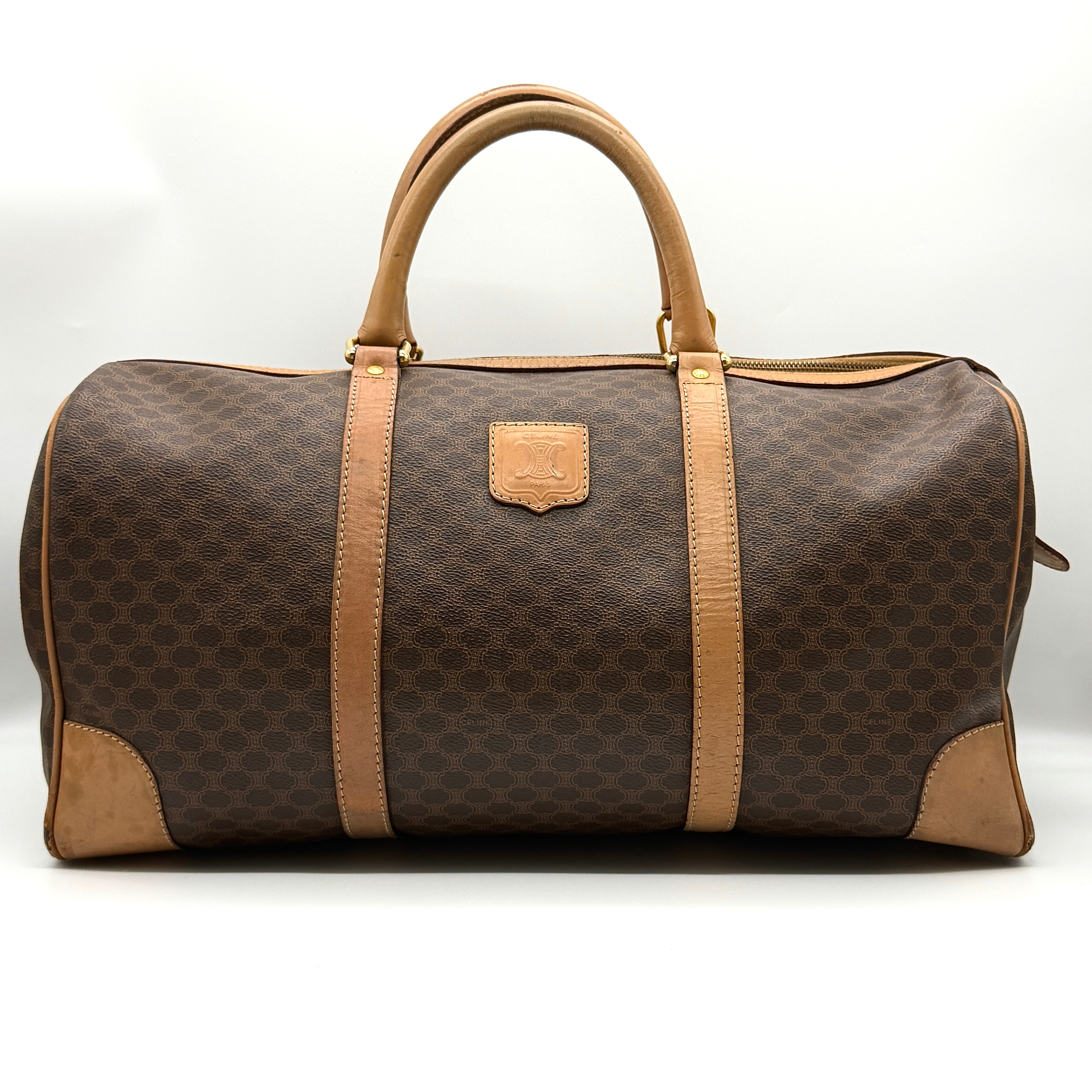 Celine Macadam Triomphe Duffle Bag in brown coated canvas with tan leather trim and gold-tone hardware