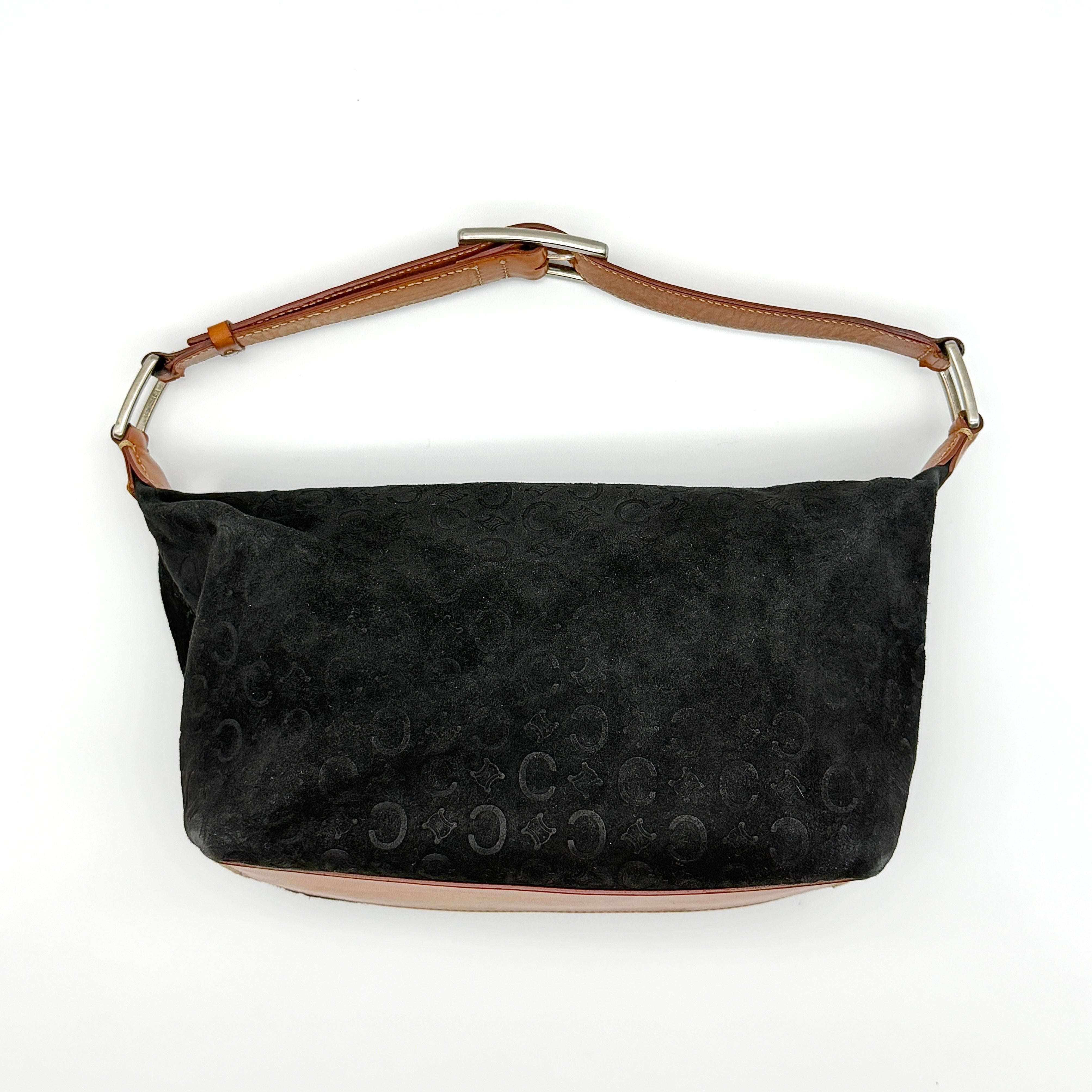 Celine Triomphe monogram shoulder bag in black suede with tan leather trim and silver-tone buckle strap.