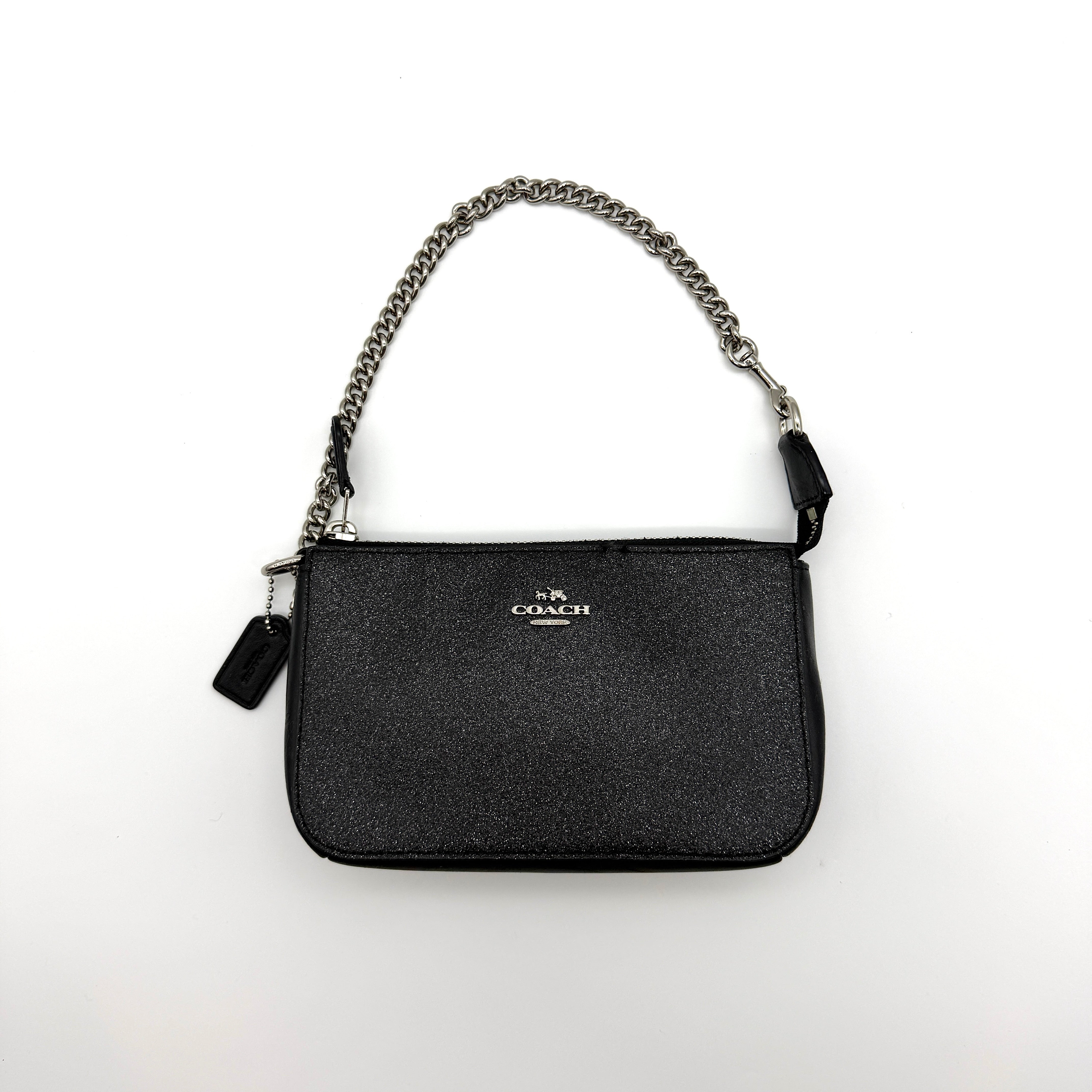 Coach Pebble Glitter Nolita 19 Shoulder Bag in black glitter leather with silver-tone chain strap and black fabric interior
