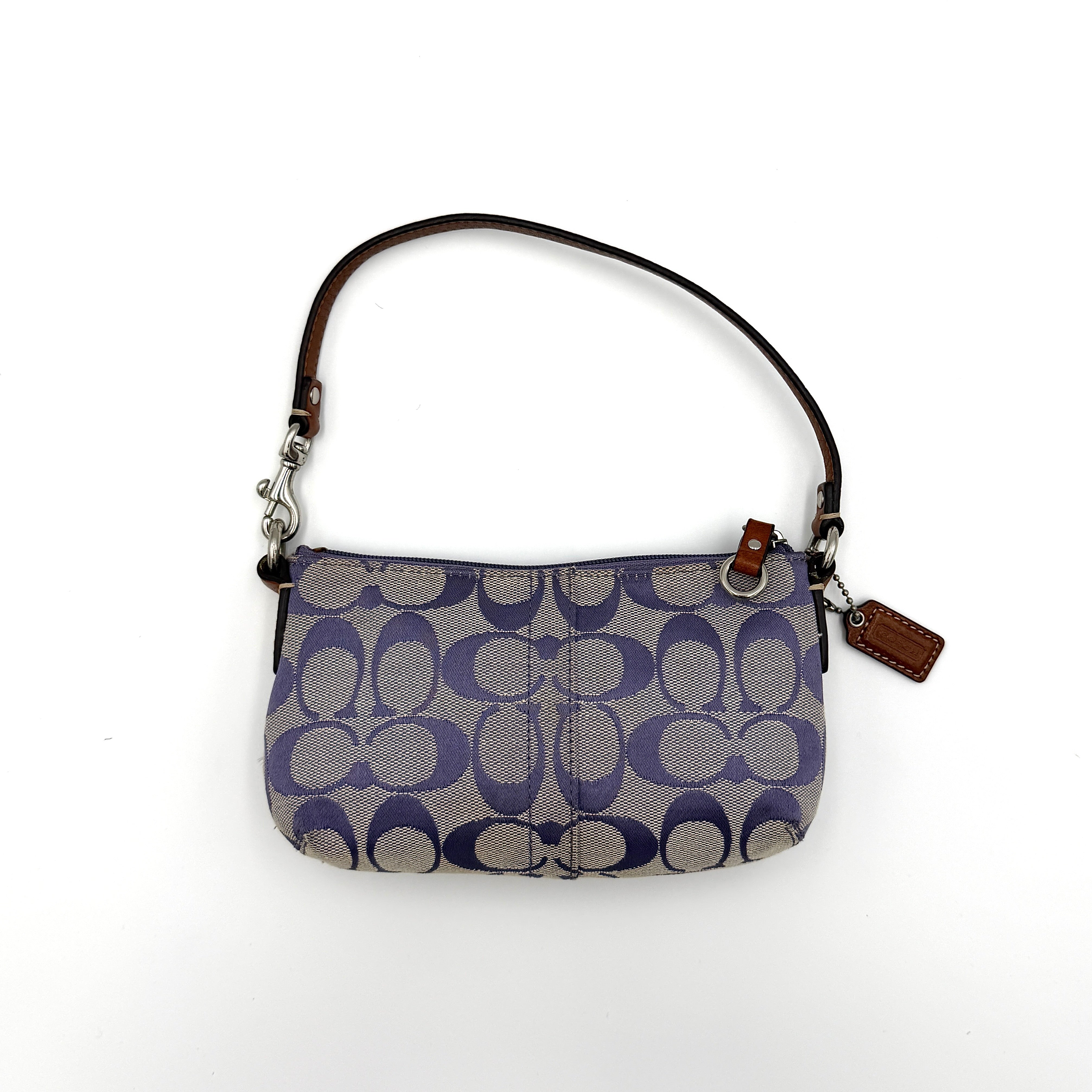 Coach Signature Canvas Mini Bag in purple and grey monogram with brown leather trim and silver-tone hardware