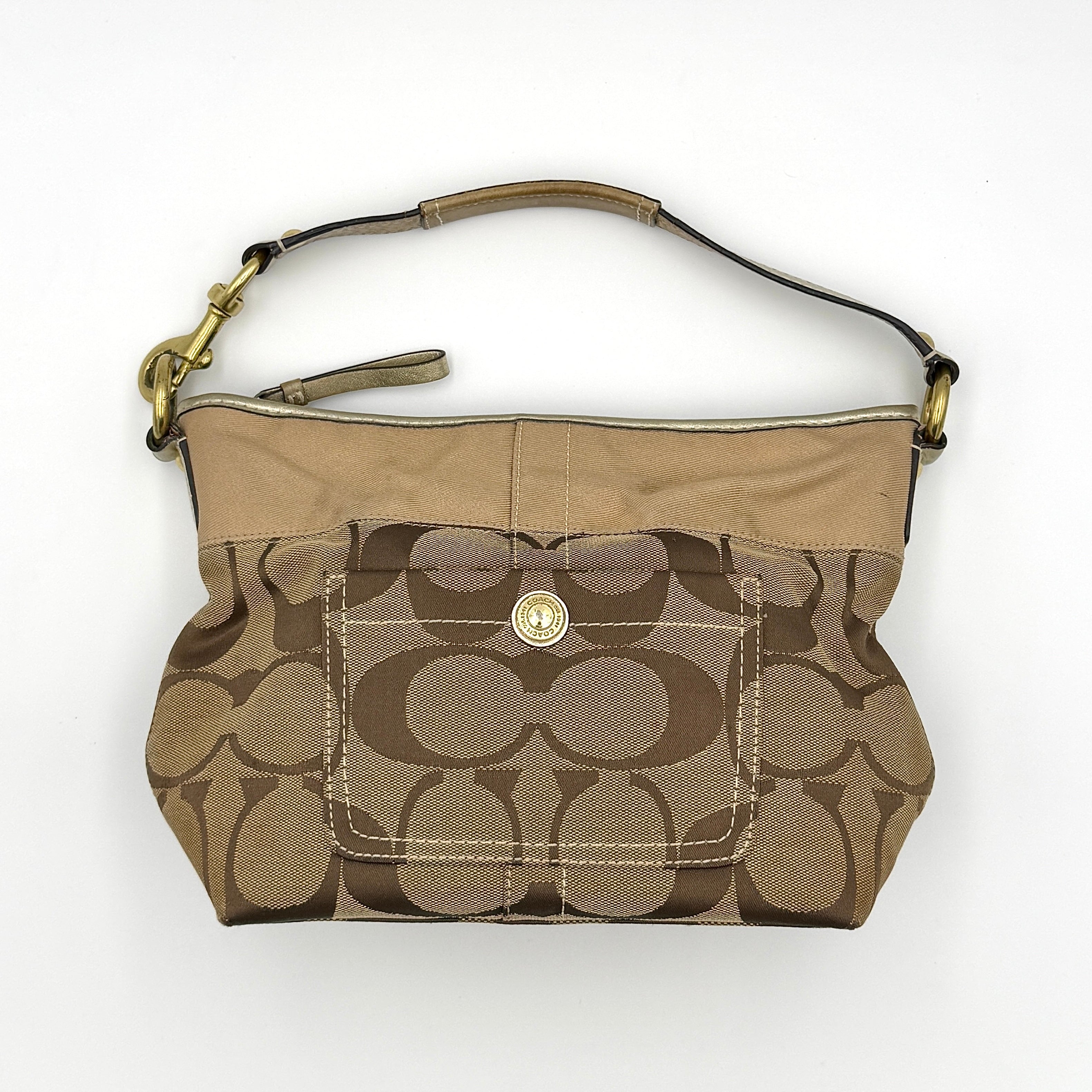 Coach Signature Canvas Shoulder Bag in beige monogram canvas with gold-tone hardware and front snap pocket.