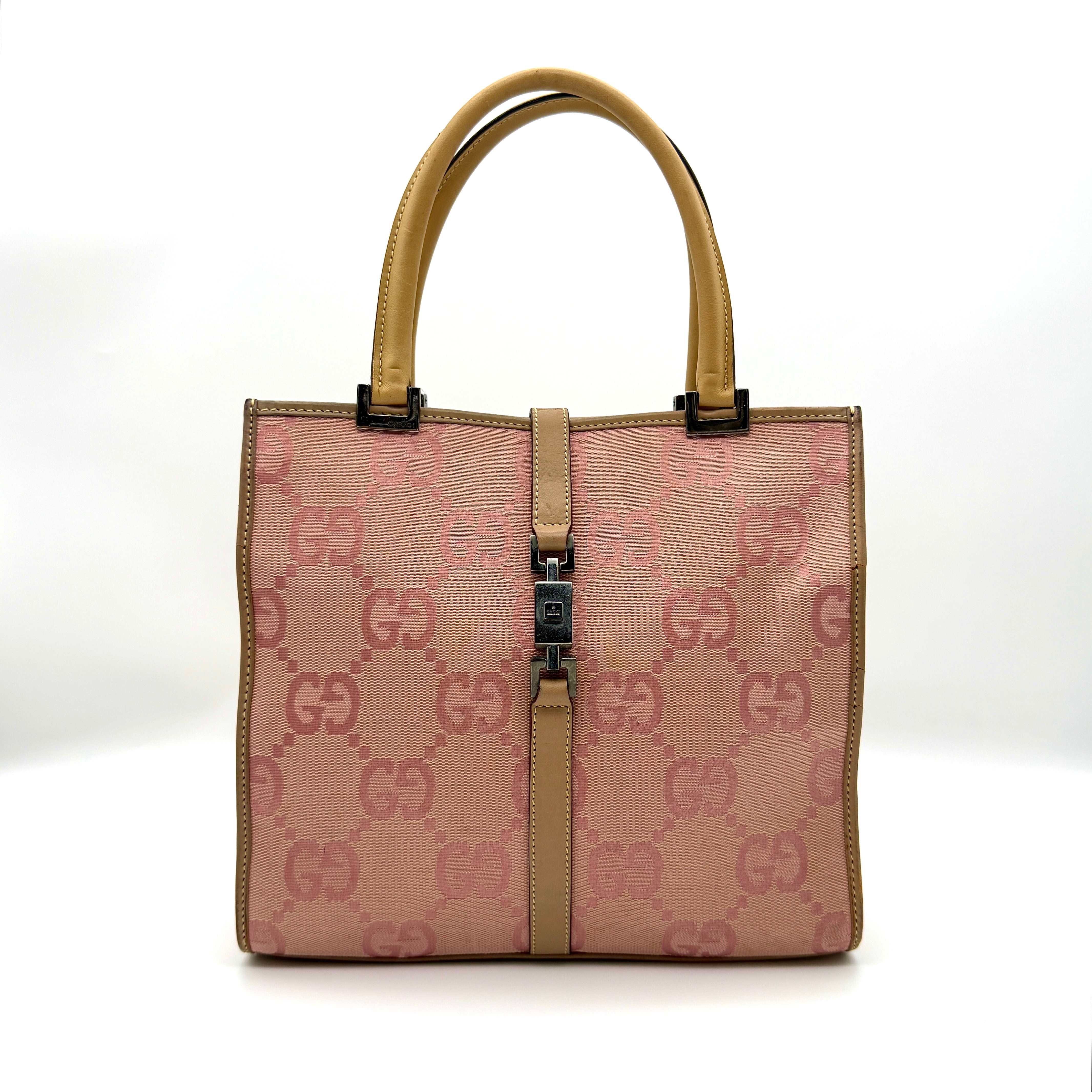 Gucci GG Monogram Jackie Tote Bag in pink jacquard canvas with beige leather trim, silver-tone piston-lock clip, and beige interior