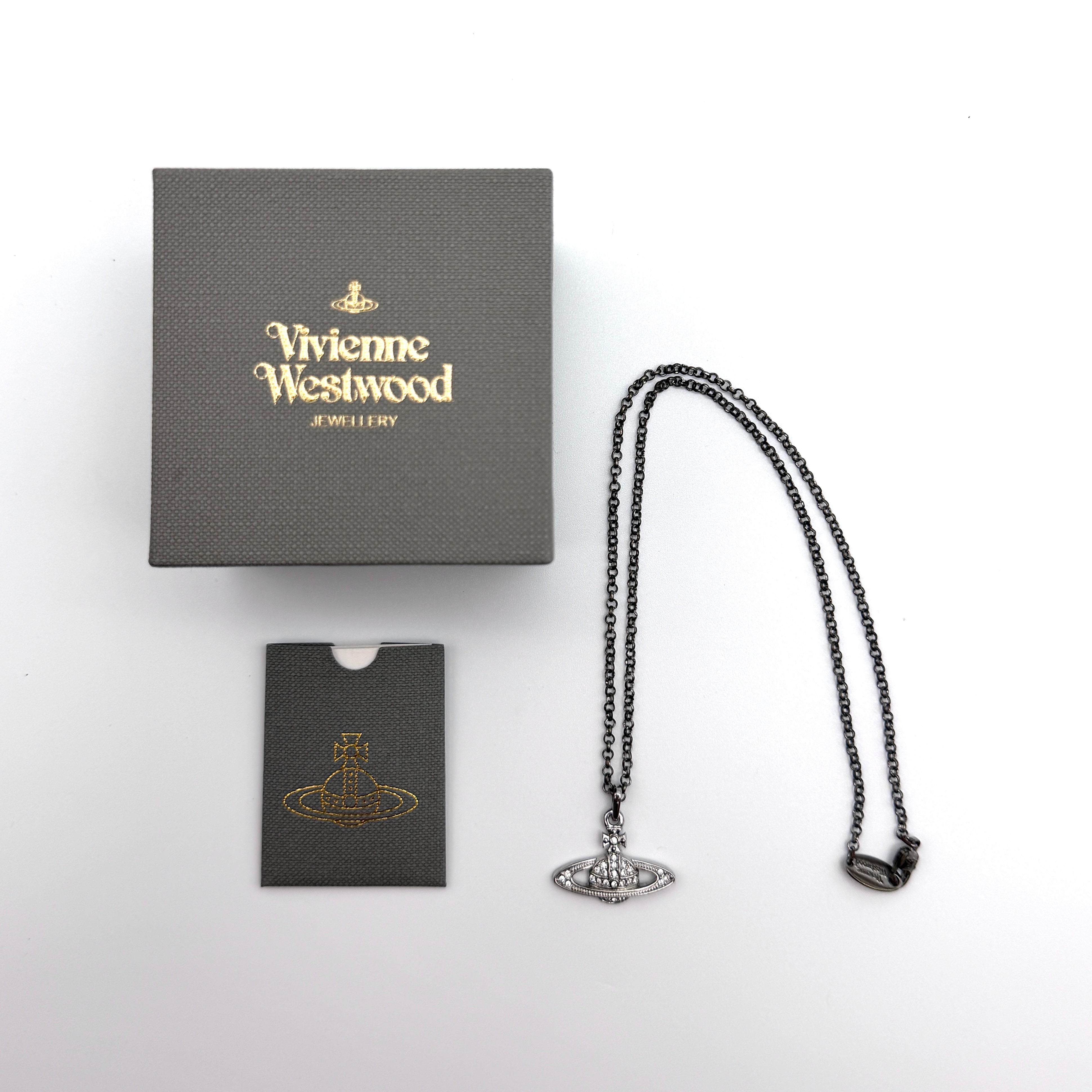 Vivienne Westwood Orb Necklace in oxidized silver with rhinestone embellishments and original box.