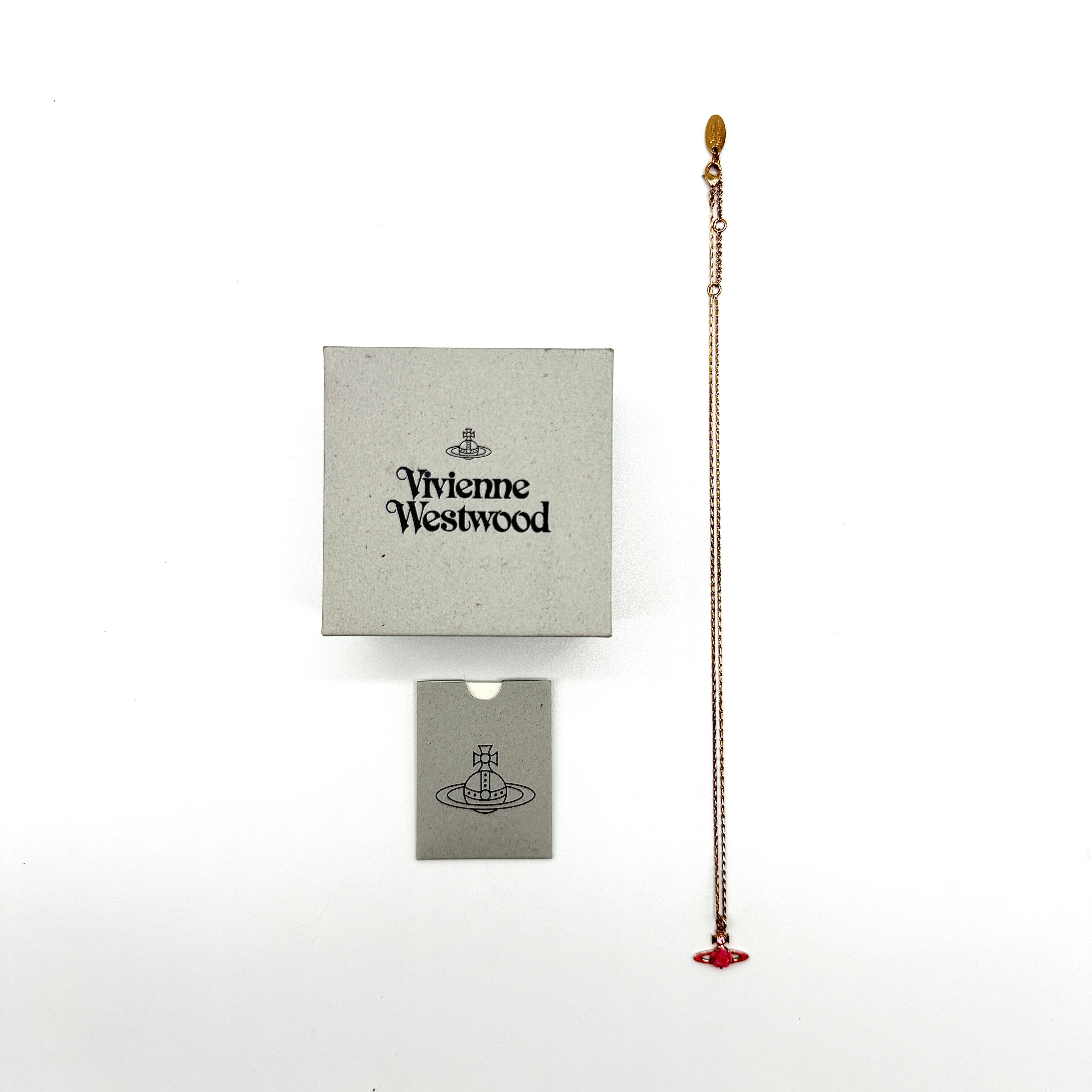 Vivienne Westwood Orb Rose Necklace in gold-tone with pink enamel orb, rose centerpiece, and crystal detailing